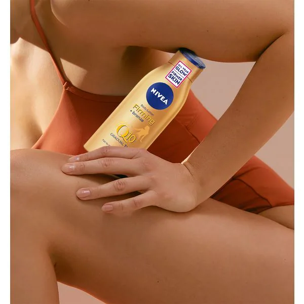 NIVEA Q10 Gradual Tan -vartalovoide vaalealle ja keskivaalealle iholle 200 ml
