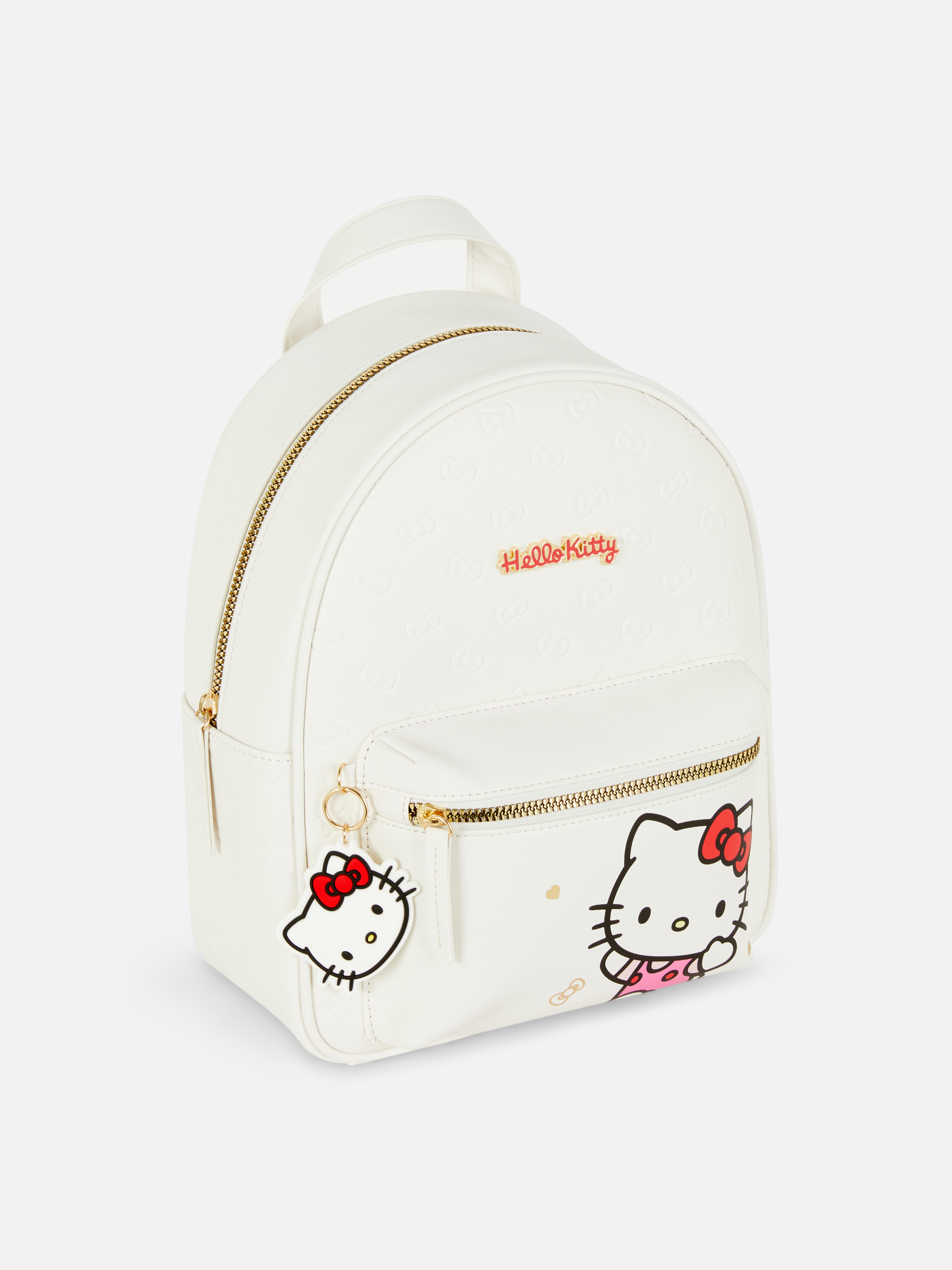 Hello Kitty hátizsák Hátizsák állítható vállpántokkal, cipzáras zsebekkel, felső fogantyúval és Hello Kitty karakterekkel