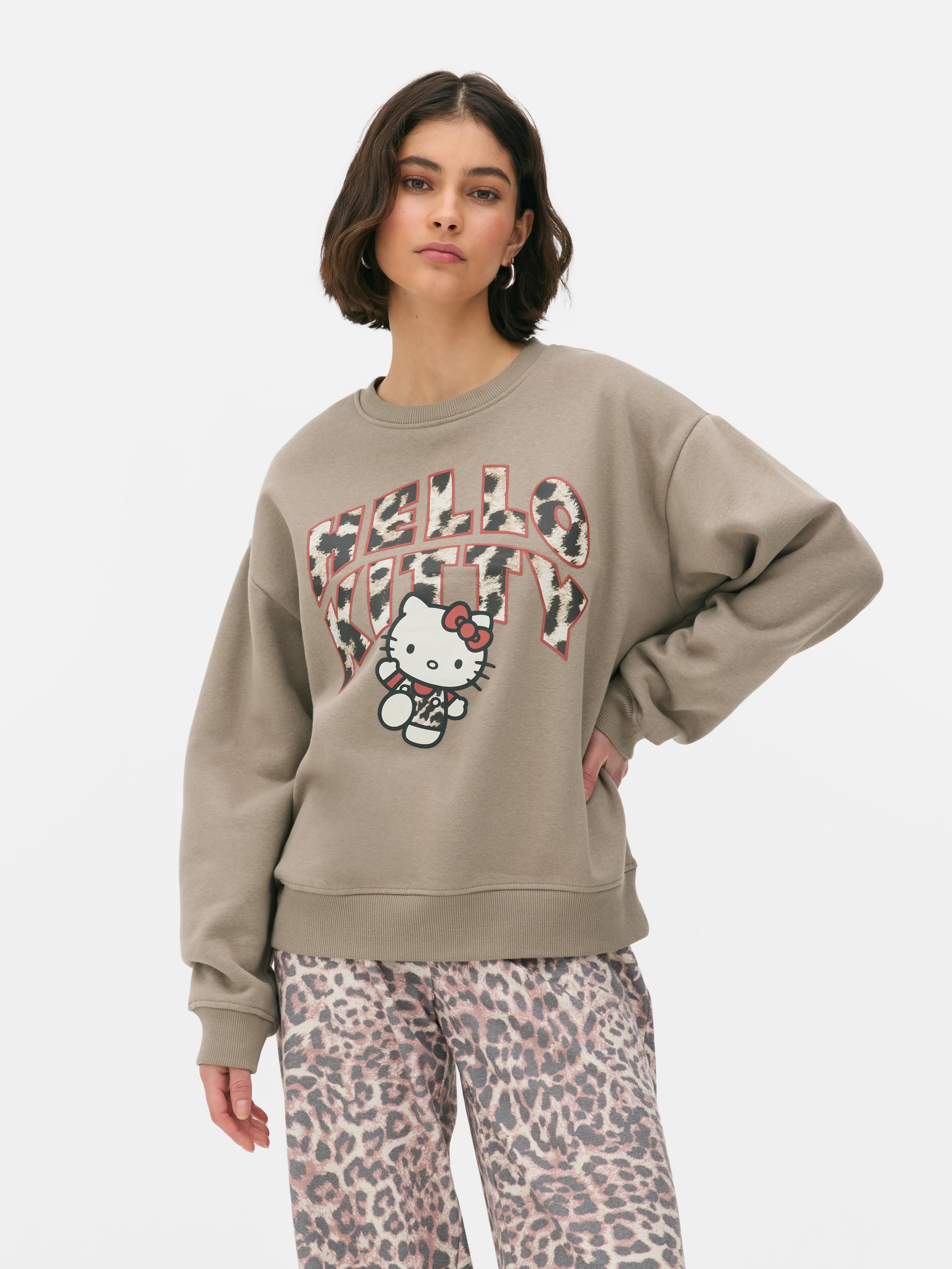 Φούτερ Hello Kitty με λεοπάρ λογότυπο. Συνδυάσαμε την Hello Kitty με λεοπάρ στάμπα. Παρακαλώ.