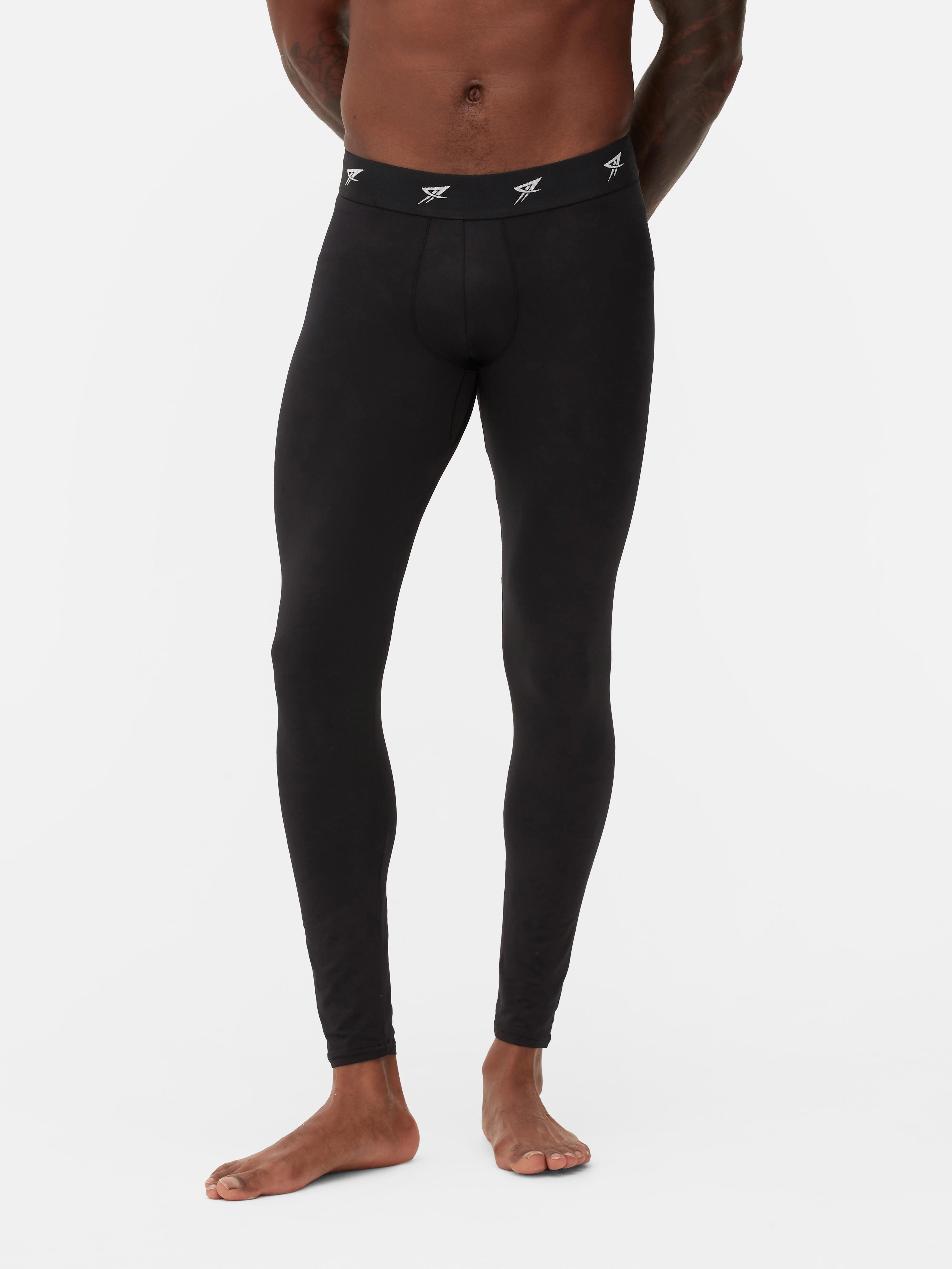 Logós derékpántos sportleggings. Testhezálló, hosszú leggings ismétlődő logóval a derékpánton.