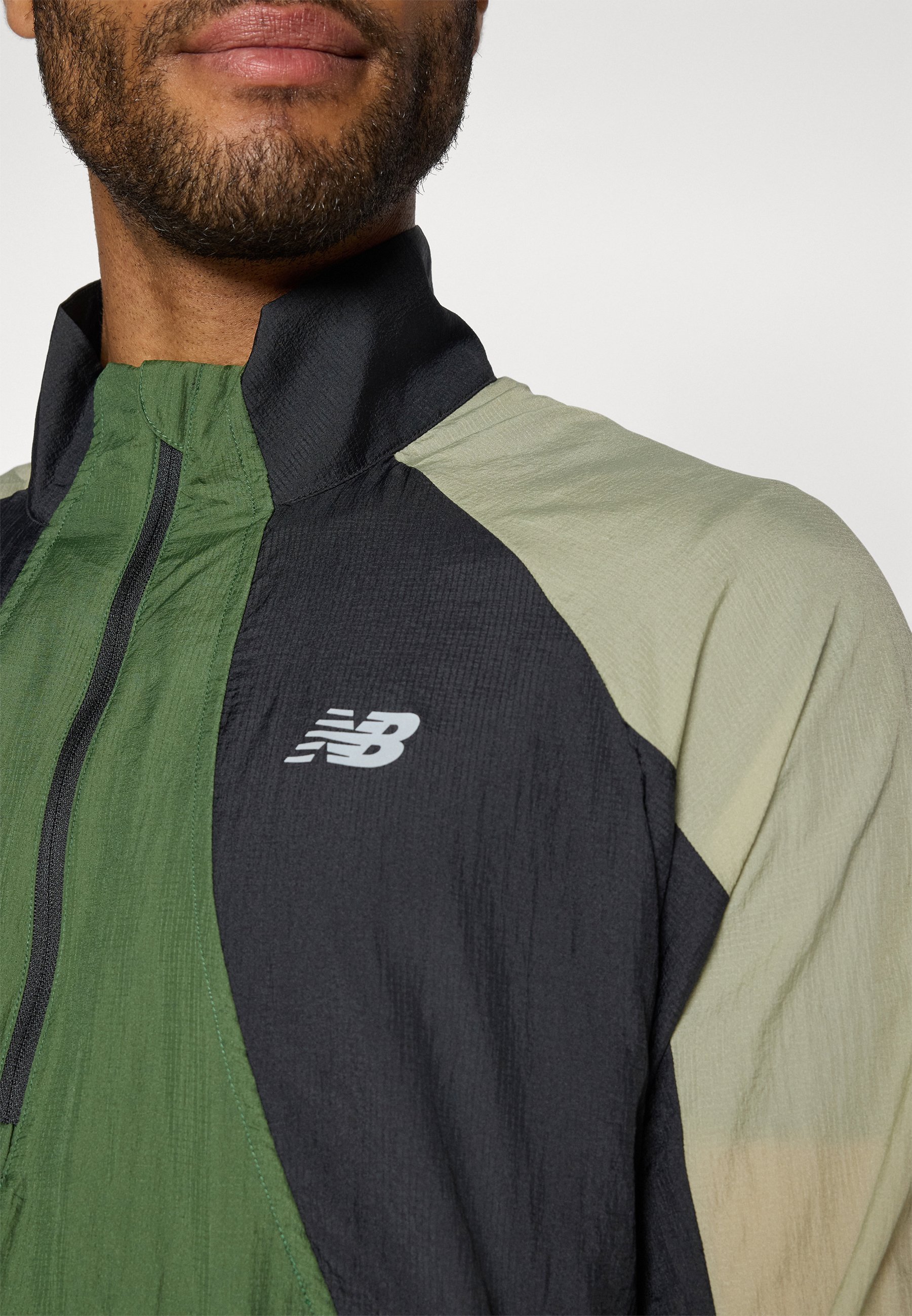 New Balance BETTER RUN WATERRESISTANT JACKET - Windbreaker - garter snake