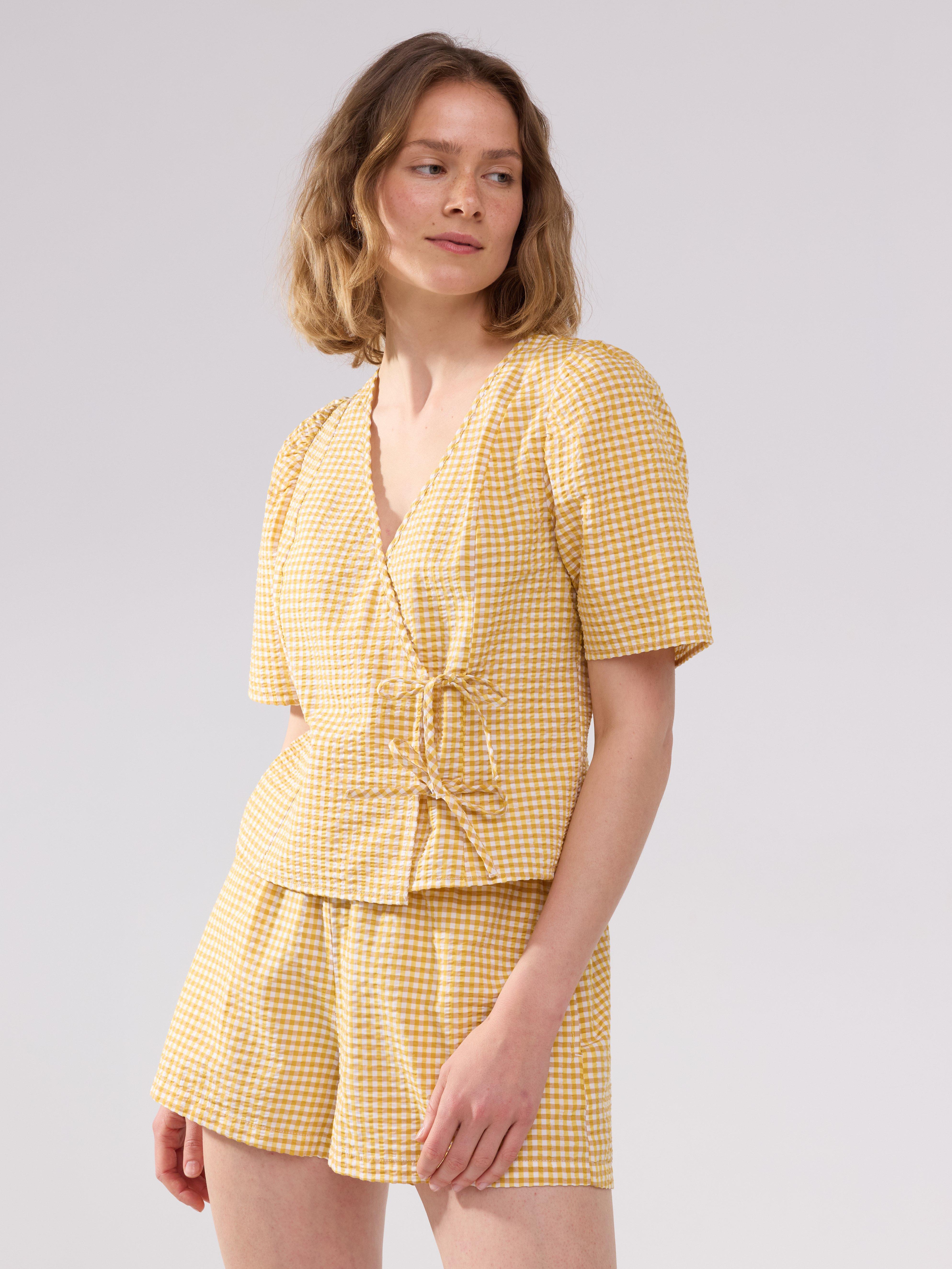 Blusa con estampado de pelícanos amarillos