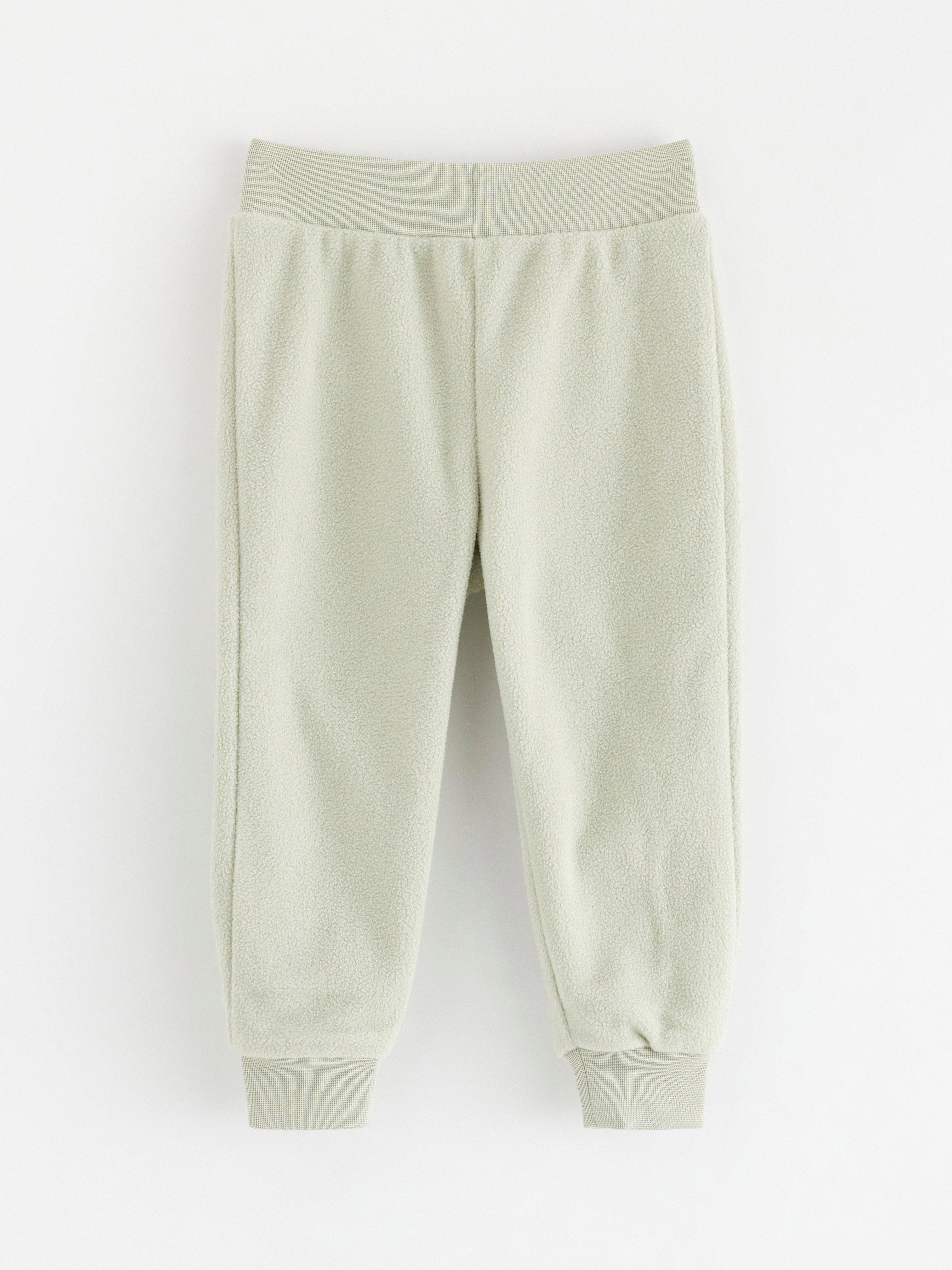 Calça de moletom fleece verde claro acinzentado