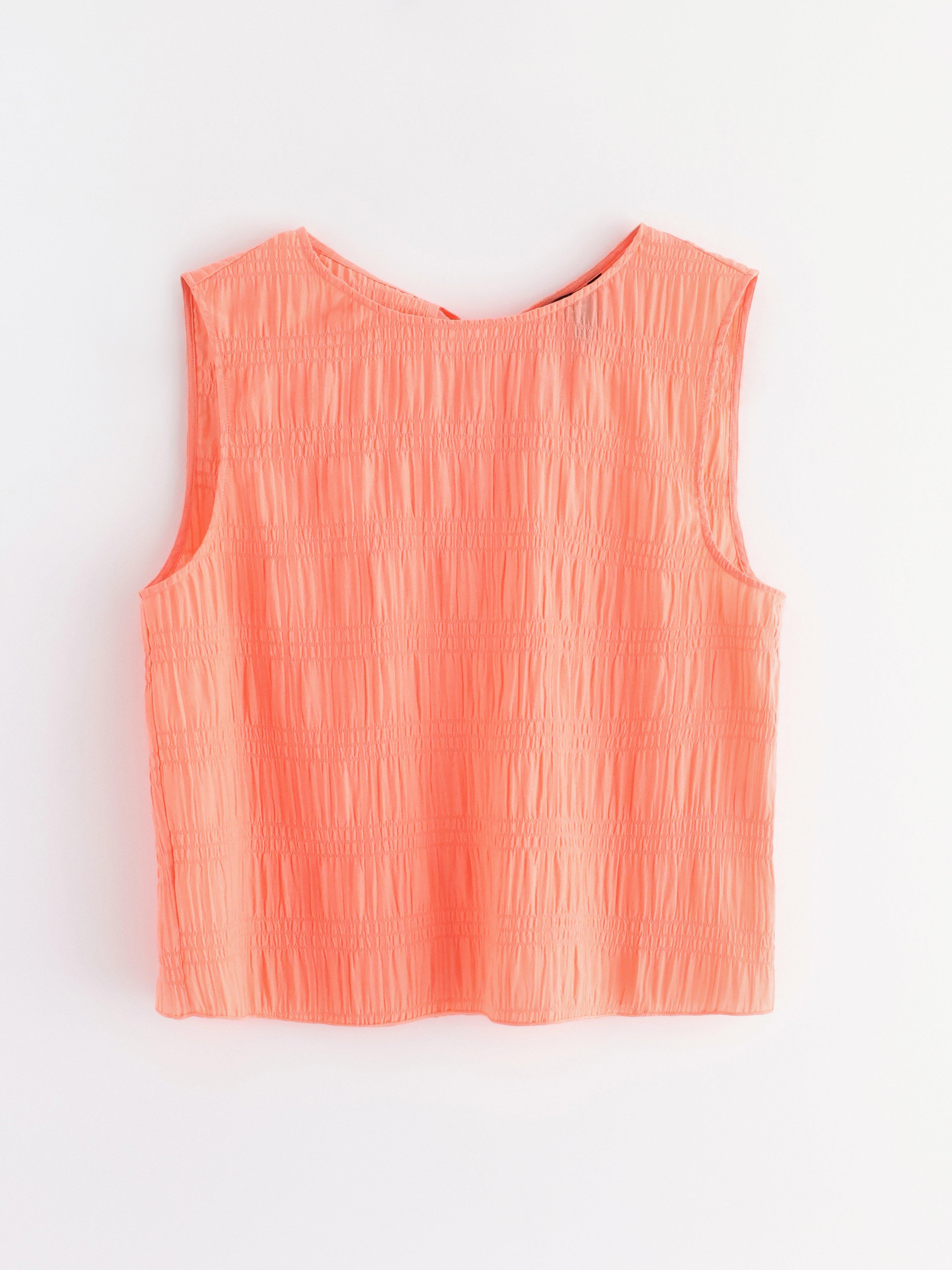 Top sin mangas color coral claro