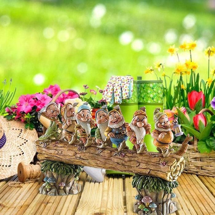 Seven dwarf trees decorate the garden, a miniature resin statue of a dwarf.