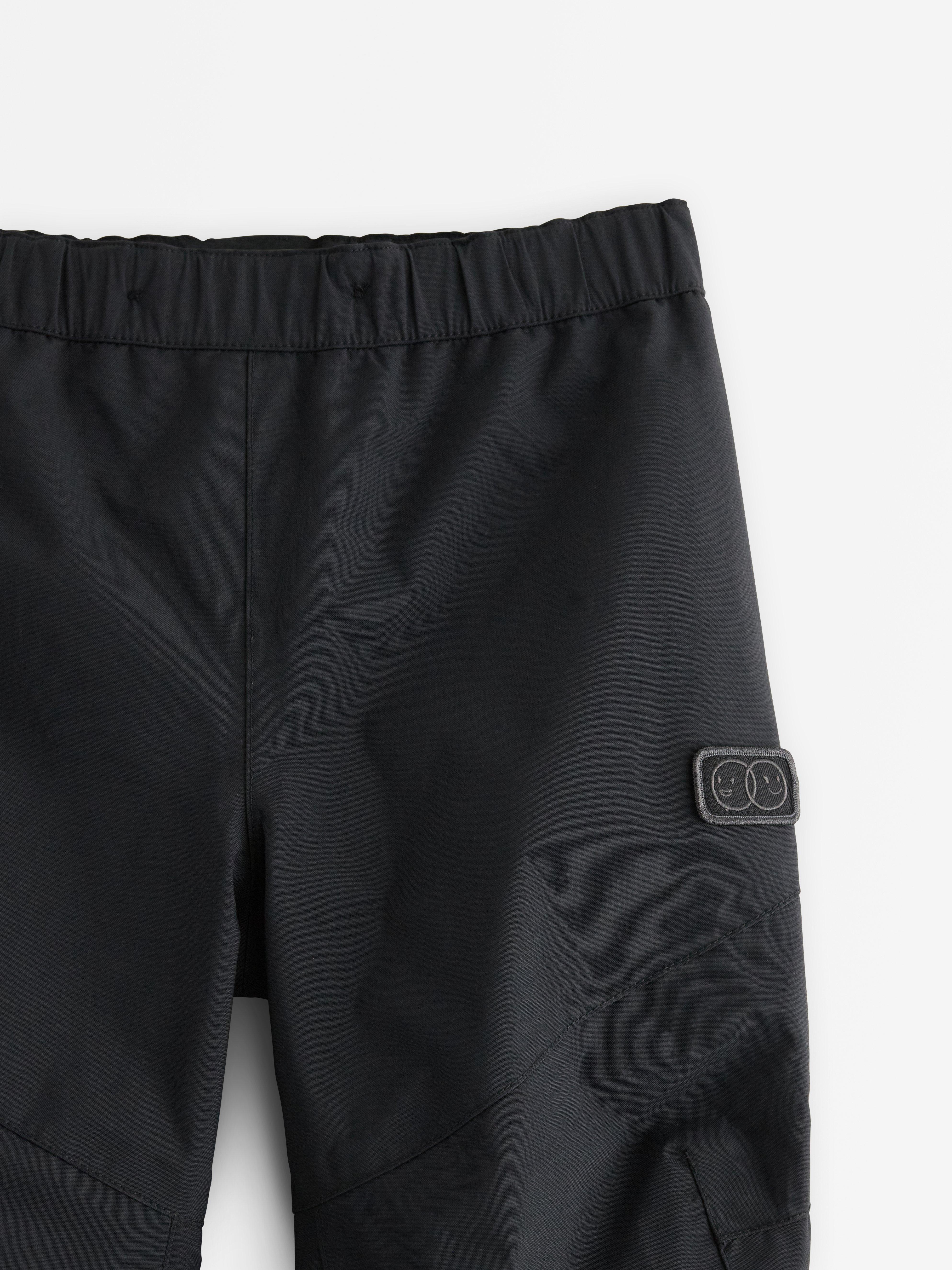 Vattentäta skalbyxor med justerbara ben – Kids Performance Wear Black