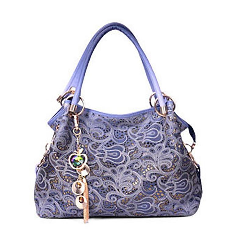 Sac à bandoulière luxueux ajouré pour femme, tendance mode 2020, idéal pour les fêtes et les vacances. Orné d'un pendentif délicat, il offre une grande capacité et une fermeture éclair en dentelle.
