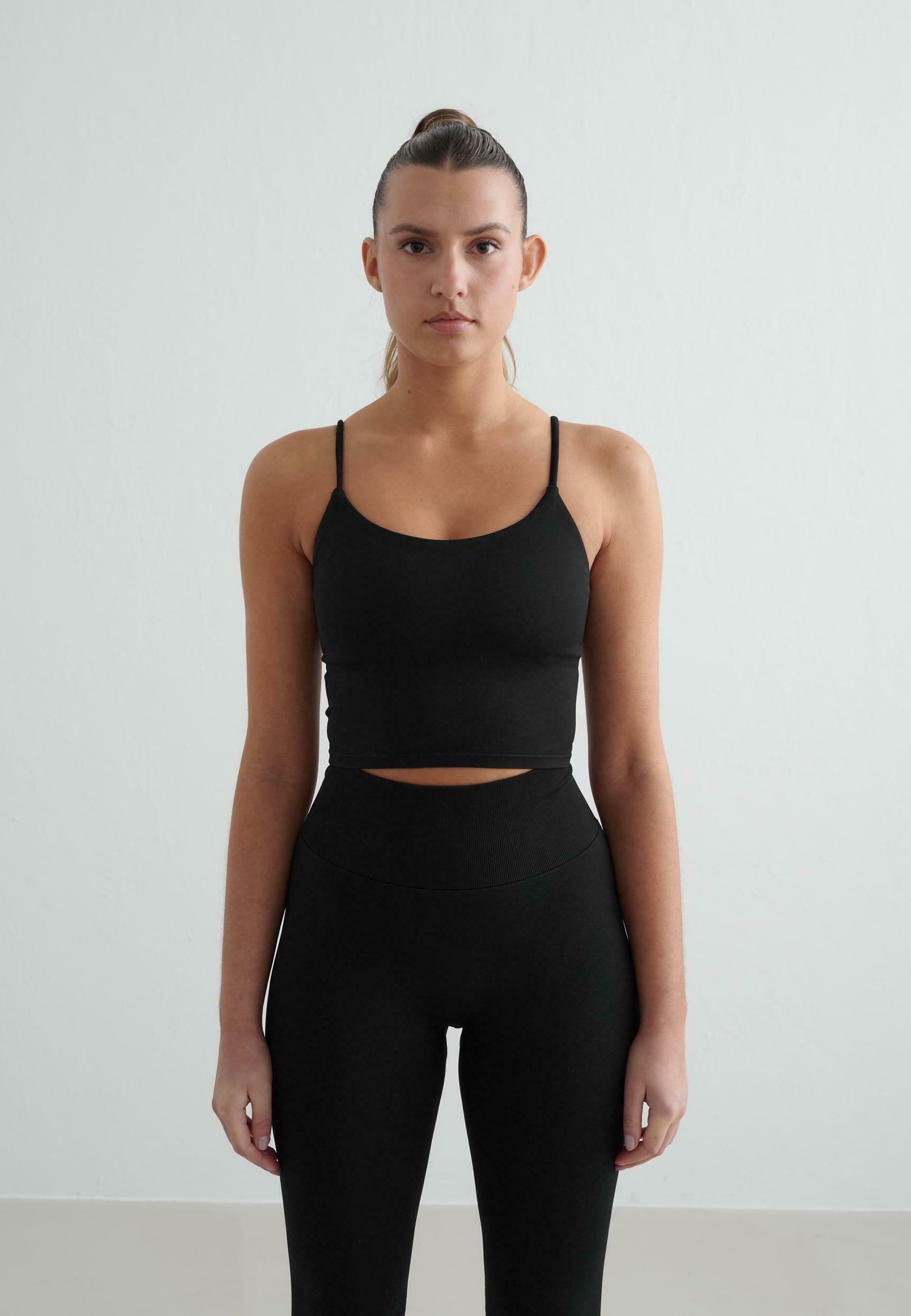 aim'n® SHAPE SEAMLESS SINGLET - Sutiã esportivo de suporte leve - preto