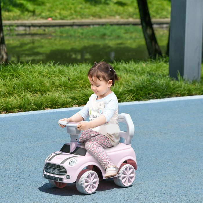 Coche de juguete para niños de 18 a 36 meses con volante, claxon y sistema antivuelco. Capacidad de carga de 25 kg. 53 x 25 x 35 cm. Rosa.