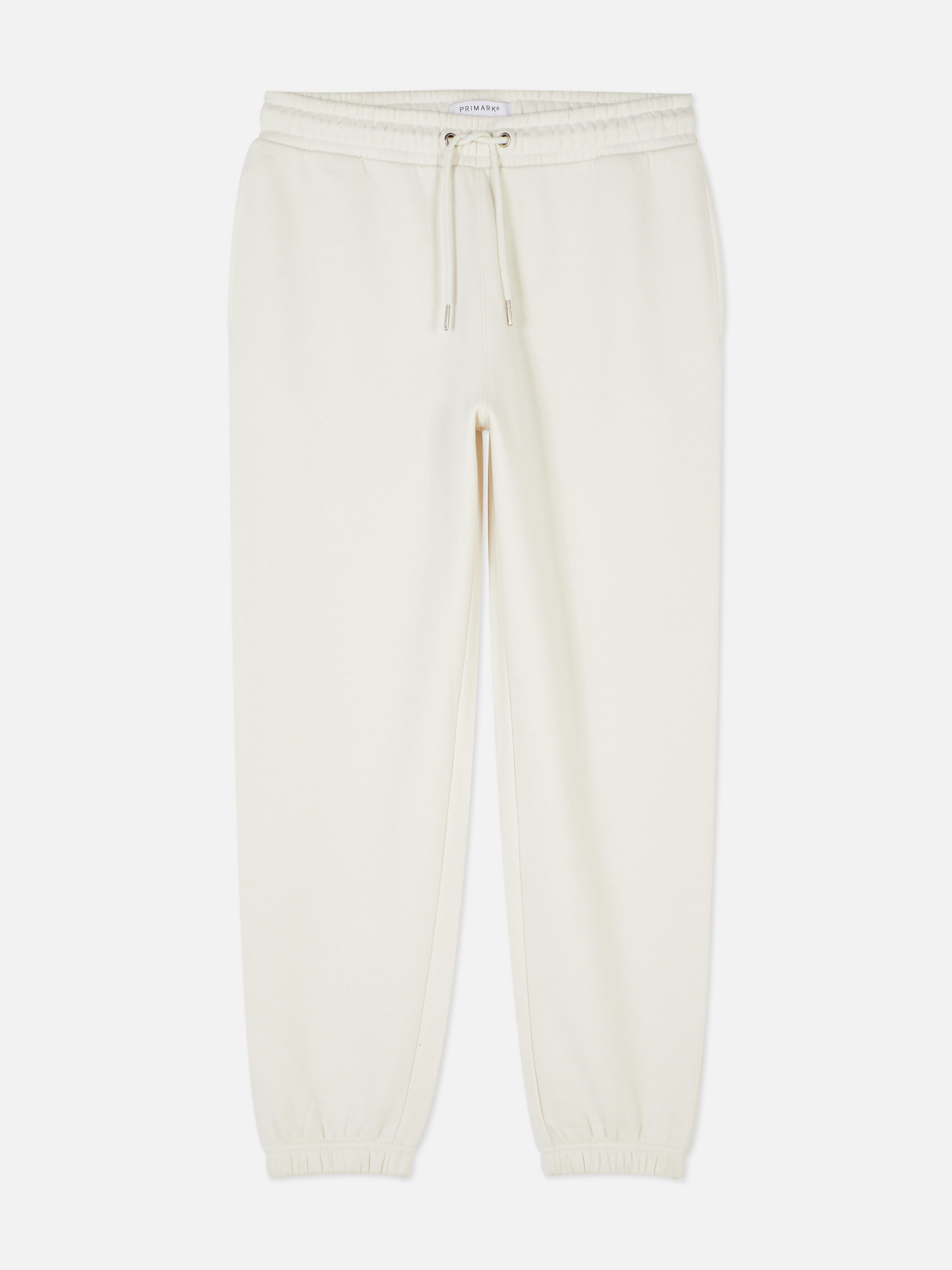 Pantaloni de jogging esențiali cu șnur de strângere Acești pantaloni de jogging confortabili cu șnur de strângere și buzunar aplicat la spate sunt casual și potriviți pentru relaxare