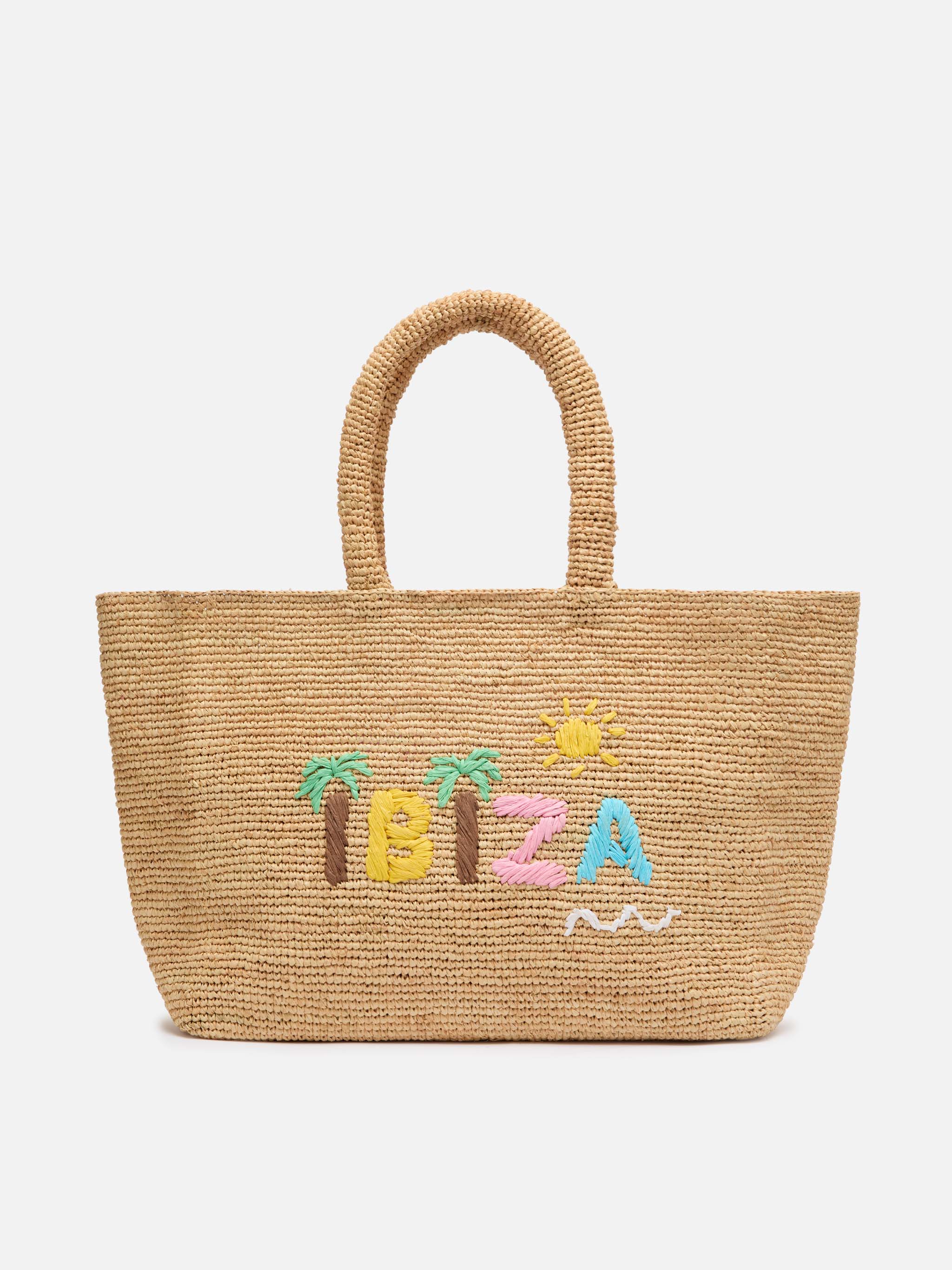 Beige raffia strandtas met katoenen binnenvak en Ibiza-borduurwerk.