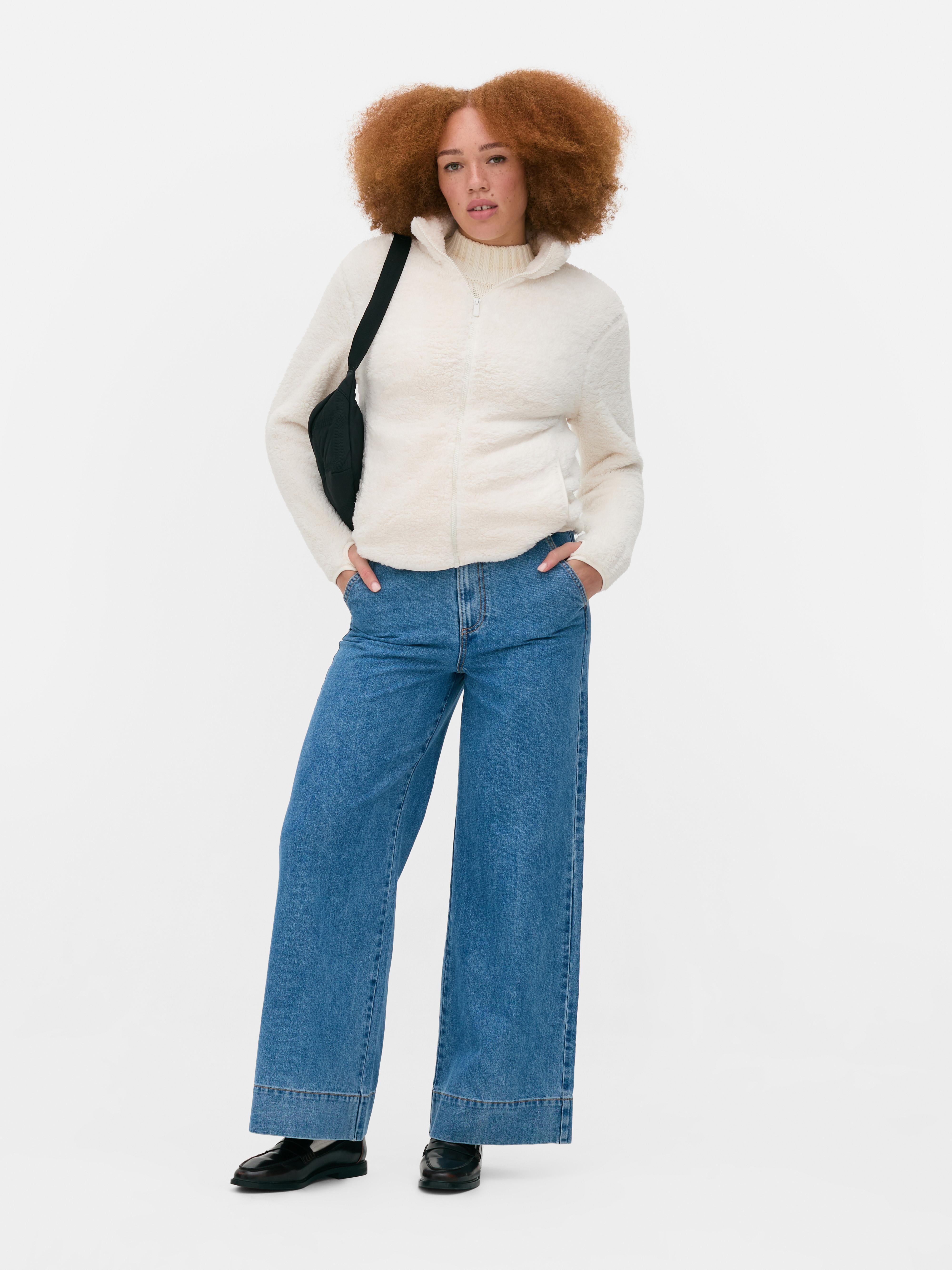 Teddy fleece zippered jacket. A soft teddy fleece jacket with long sleeves, a stand-up collar, and a full-length zipper.