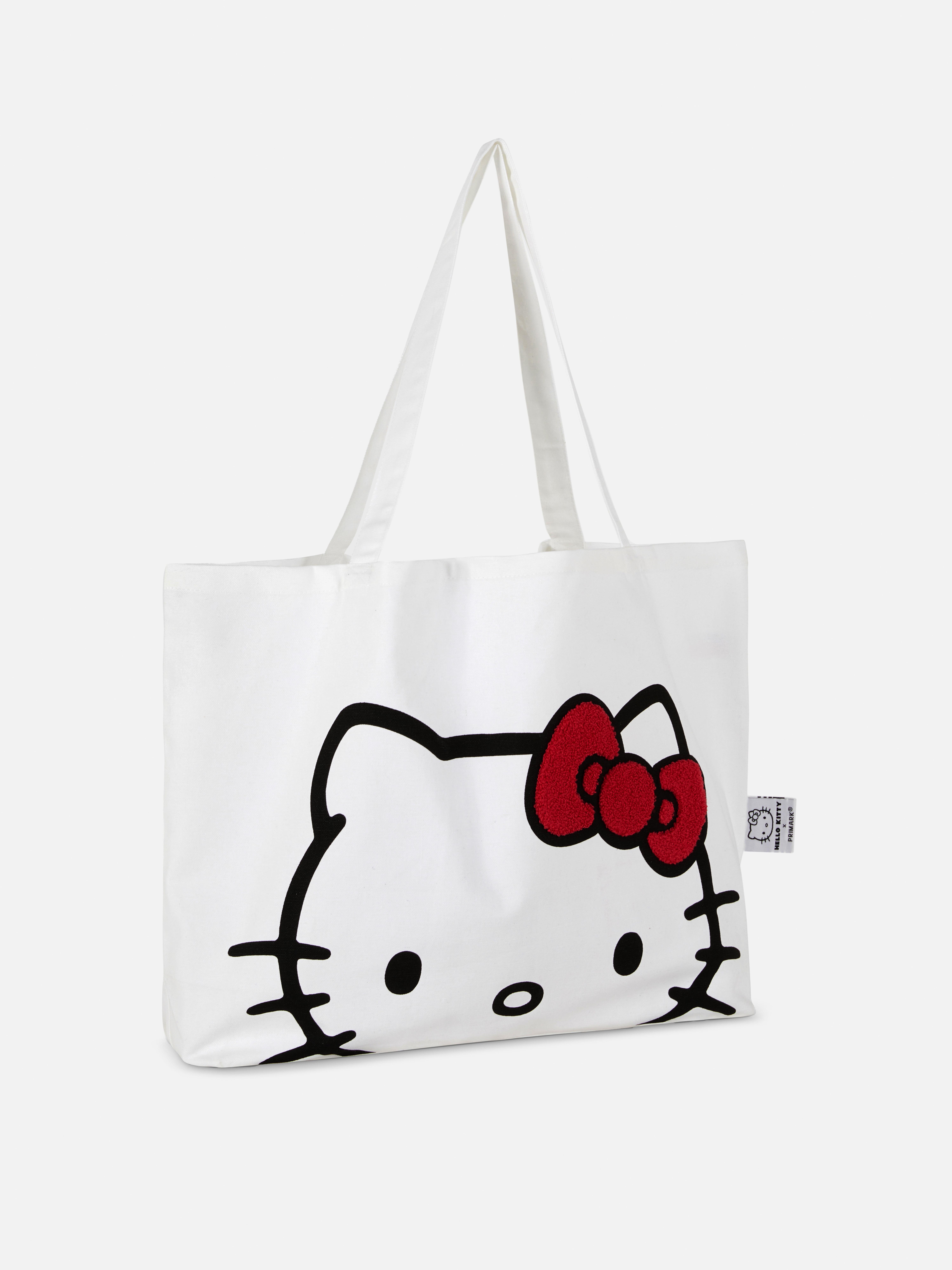 Hello Kitty vászontáska Hello Kitty vászontáska vállpántokkal és buklé díszítéssel