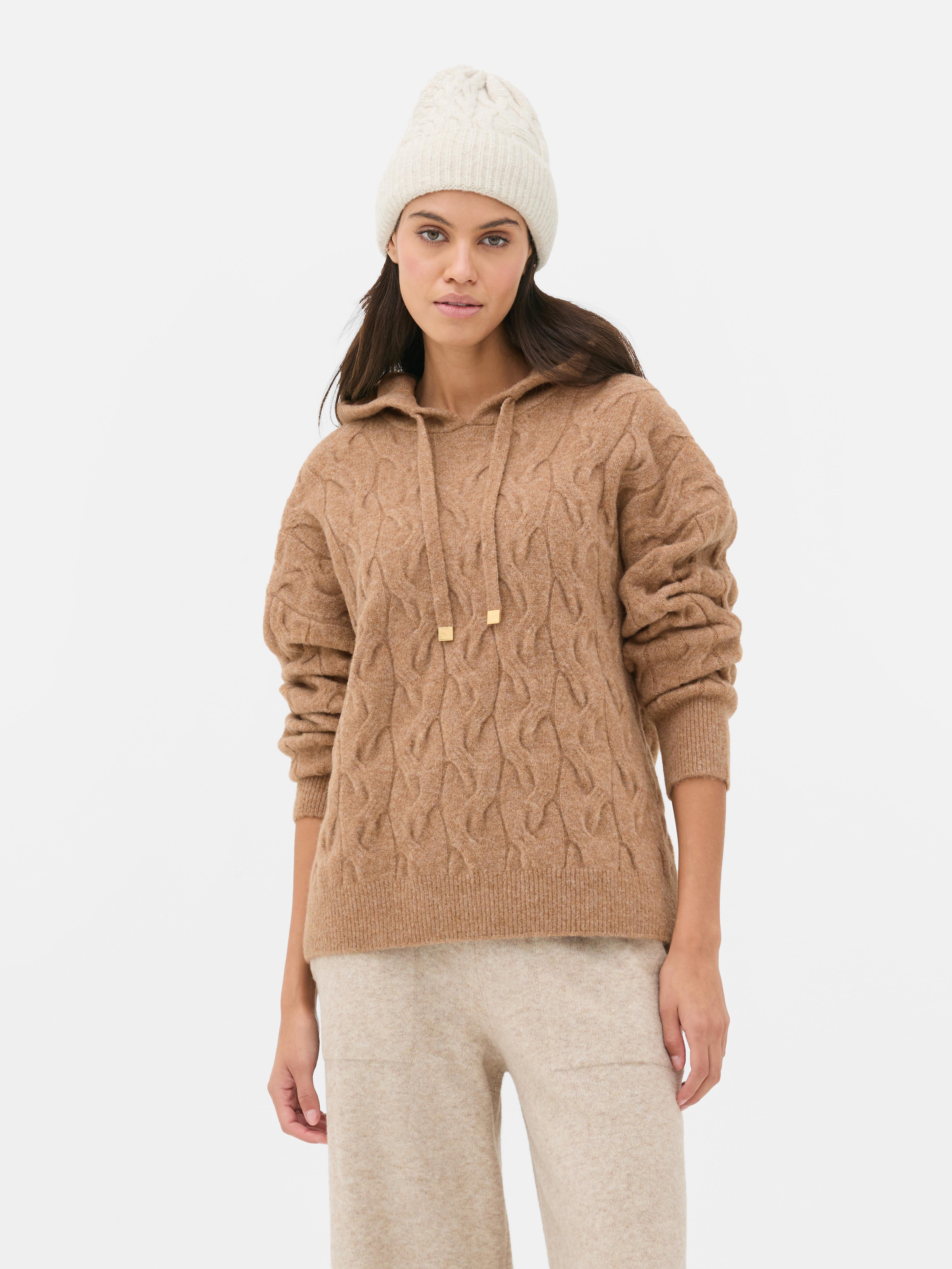 Felpa con cappuccio a trecce Una felpa con cappuccio a trecce con coulisse e maniche lunghe con polsini a coste