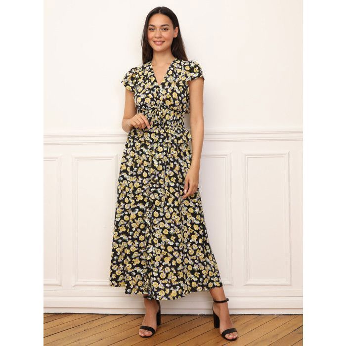 Vestido largo estampado floral con volantes en la parte delantera y en la cintura. Cuenta con dos filas de elástico en la cintura y...