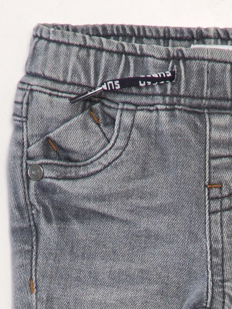 Jeans met uitsnijdingen - GRIJS