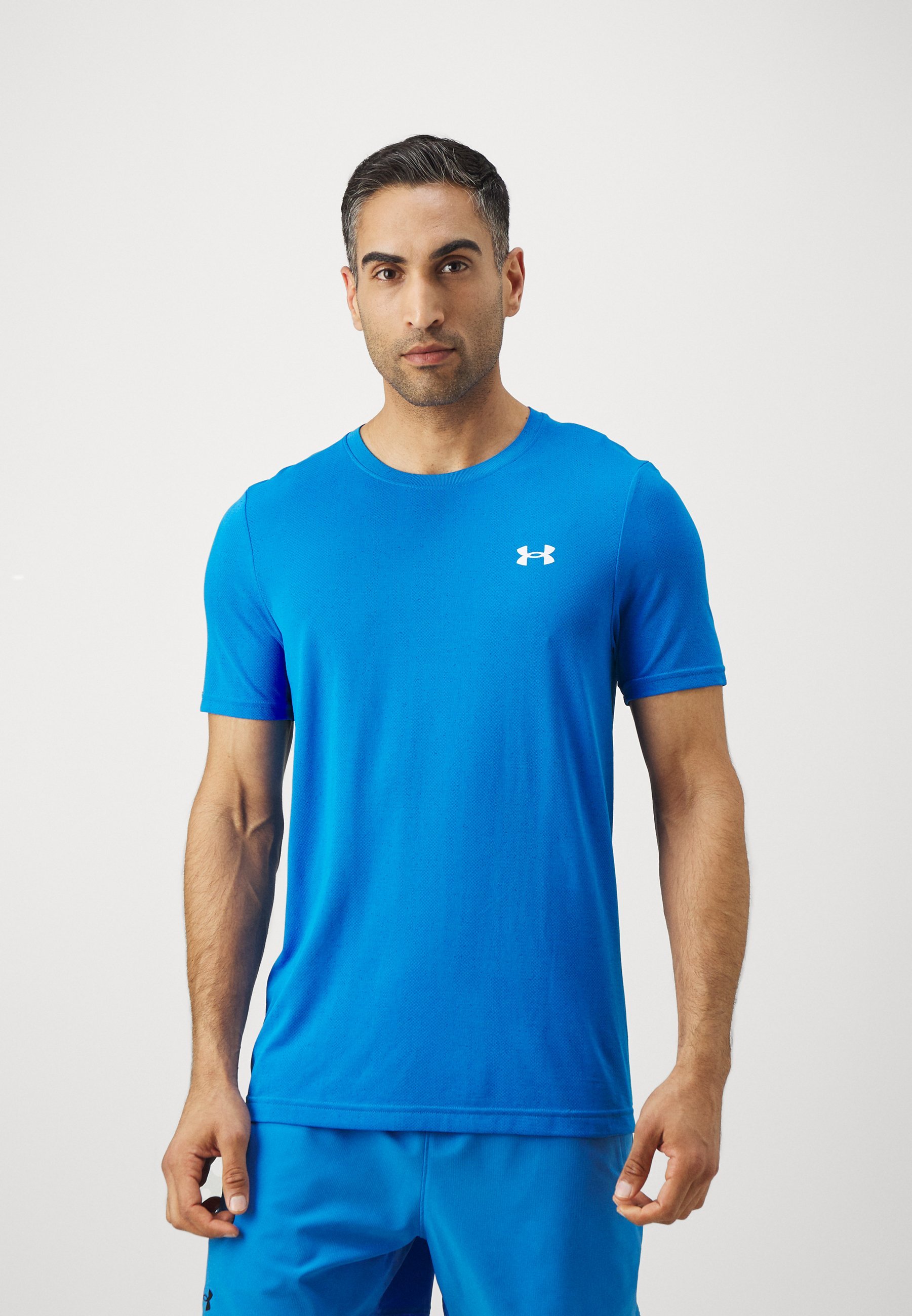 Under Armour VANISH SEAMLESS NOVELTY - T-shirt met print - blauw Atlantis/wit