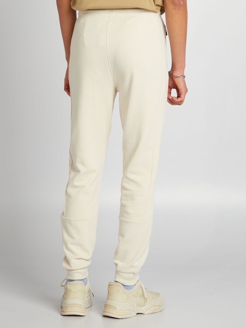 Pantalones deportivos con detalles en contraste - beige
