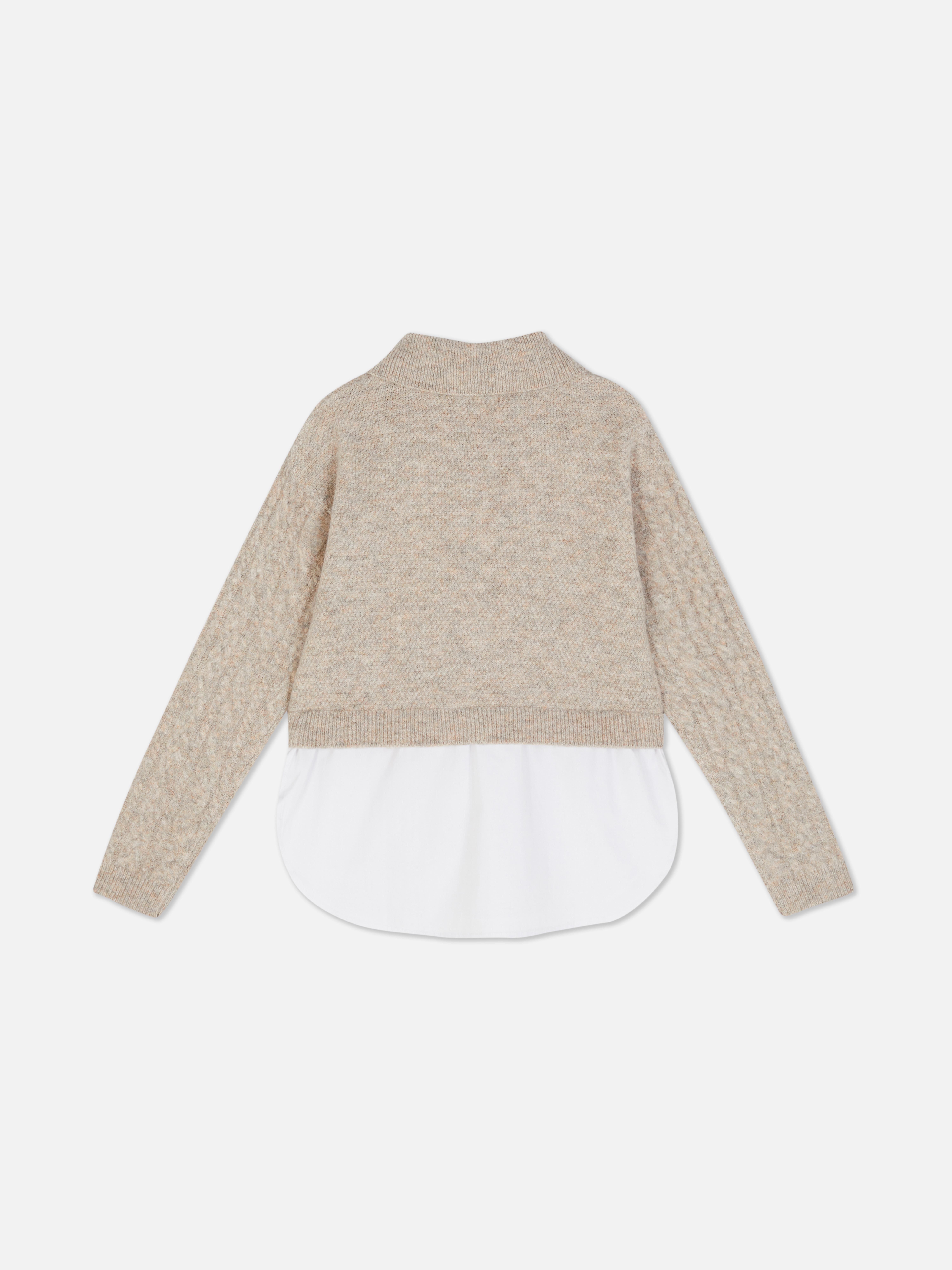 Cable knit sweater with shirt 2-in-1 A cable knit shirt sweater with a collar and ribbed cuffs