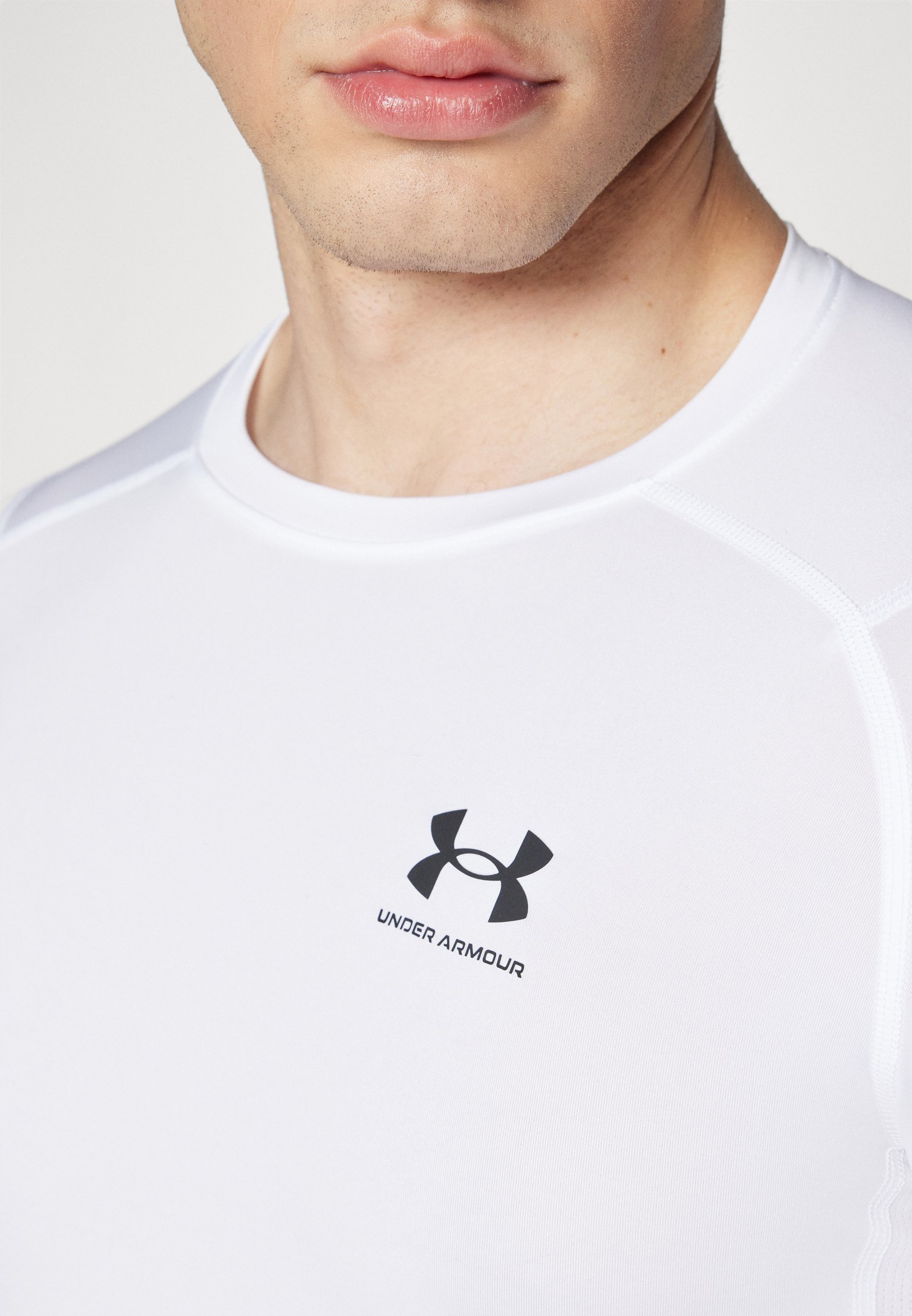 Under Armour HEATGEAR - Sport T-shirt - wit/zwart