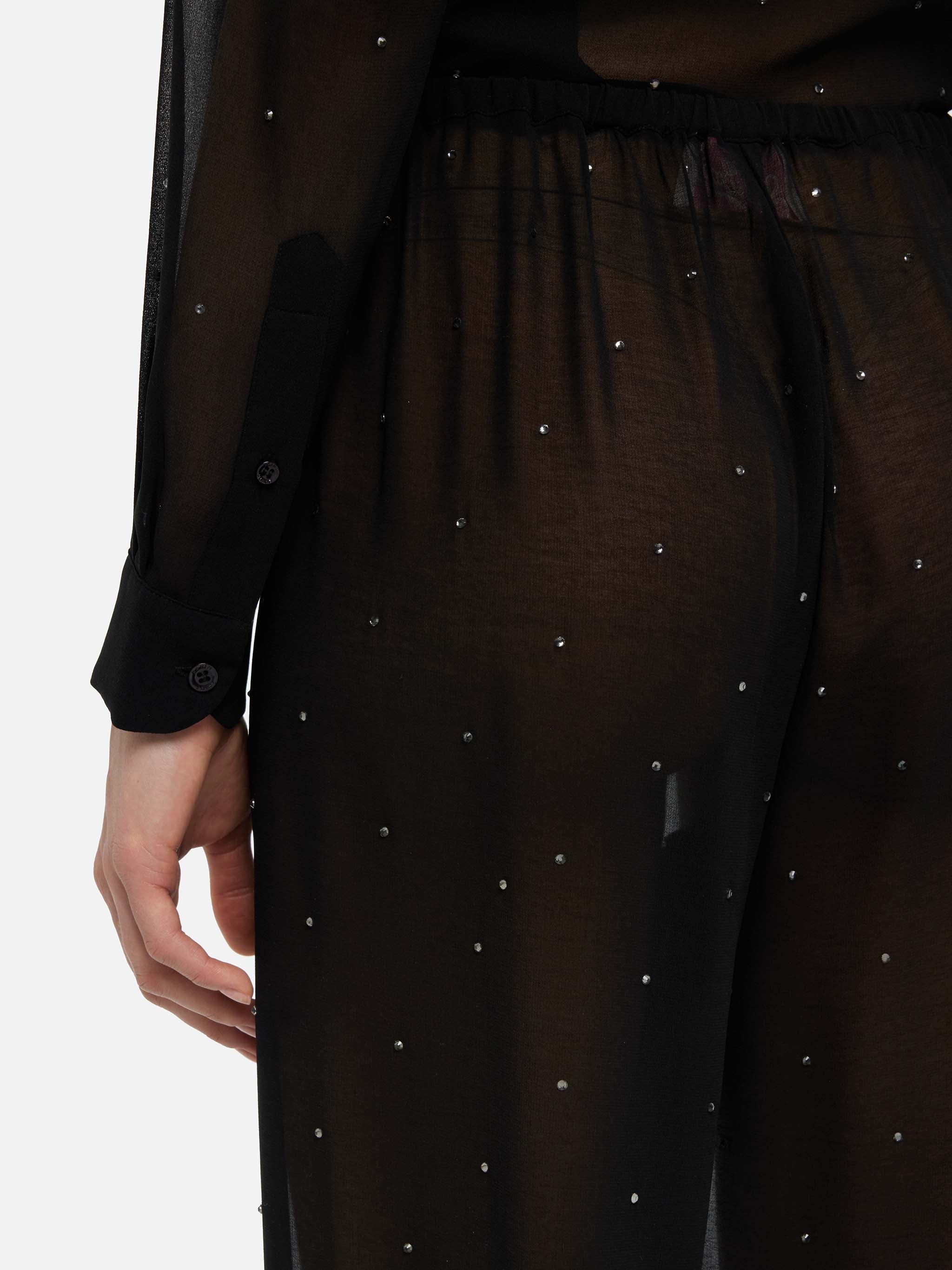 Pantaloni ampi Amalia in georgette nera con strass