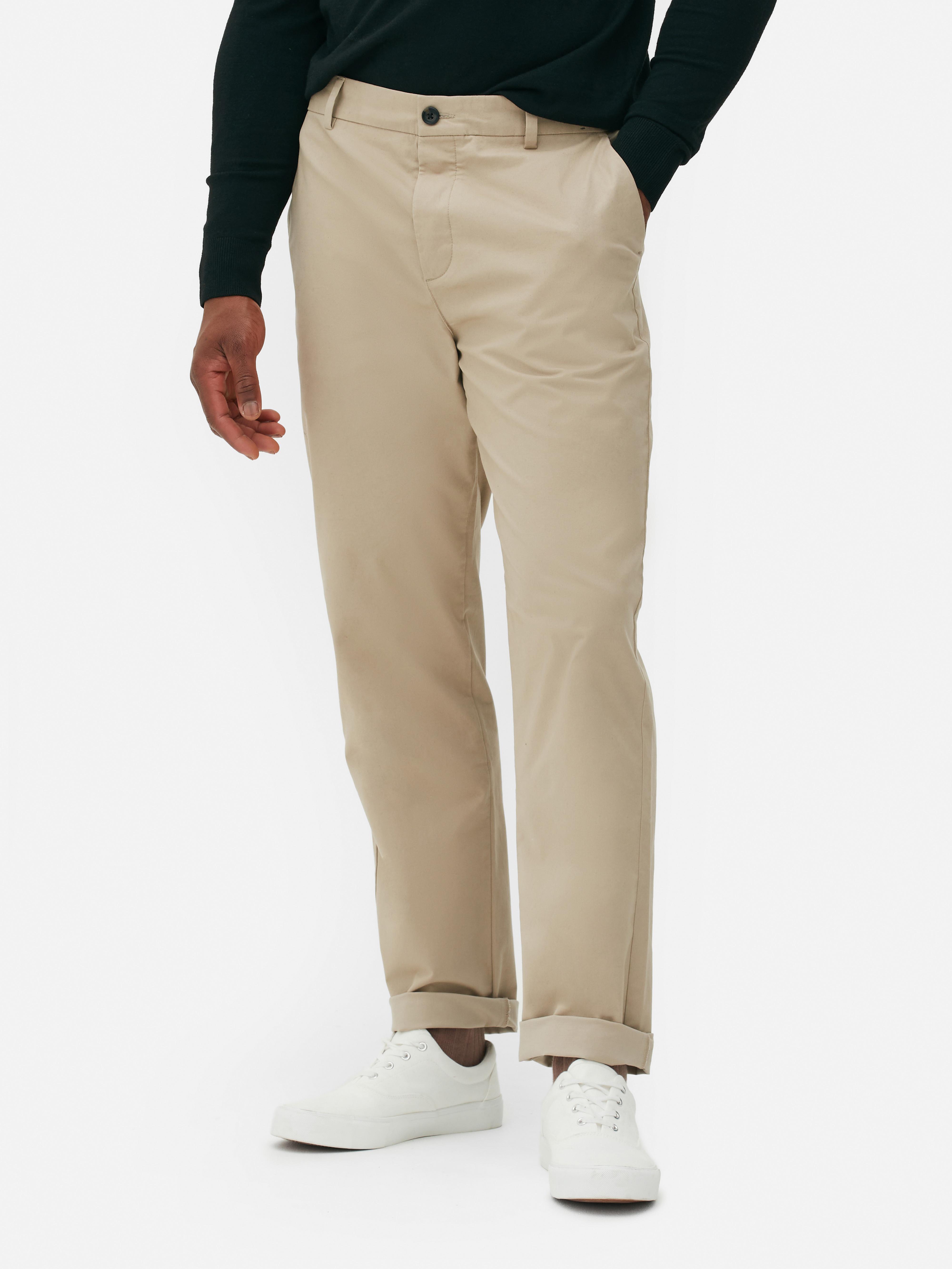 Pantaloni chino elastici cu croială dreaptă, cu închidere ascunsă cu nasturi și buzunare laterale practice