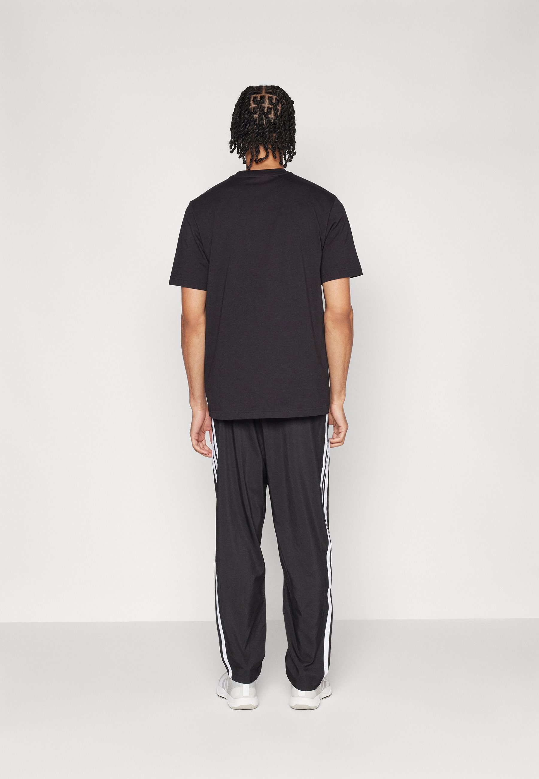 adidas Sportswear ESSENTIALS 3-STRIPES STANFORD OPEN HEM - Trainingsbroek - zwart/wit