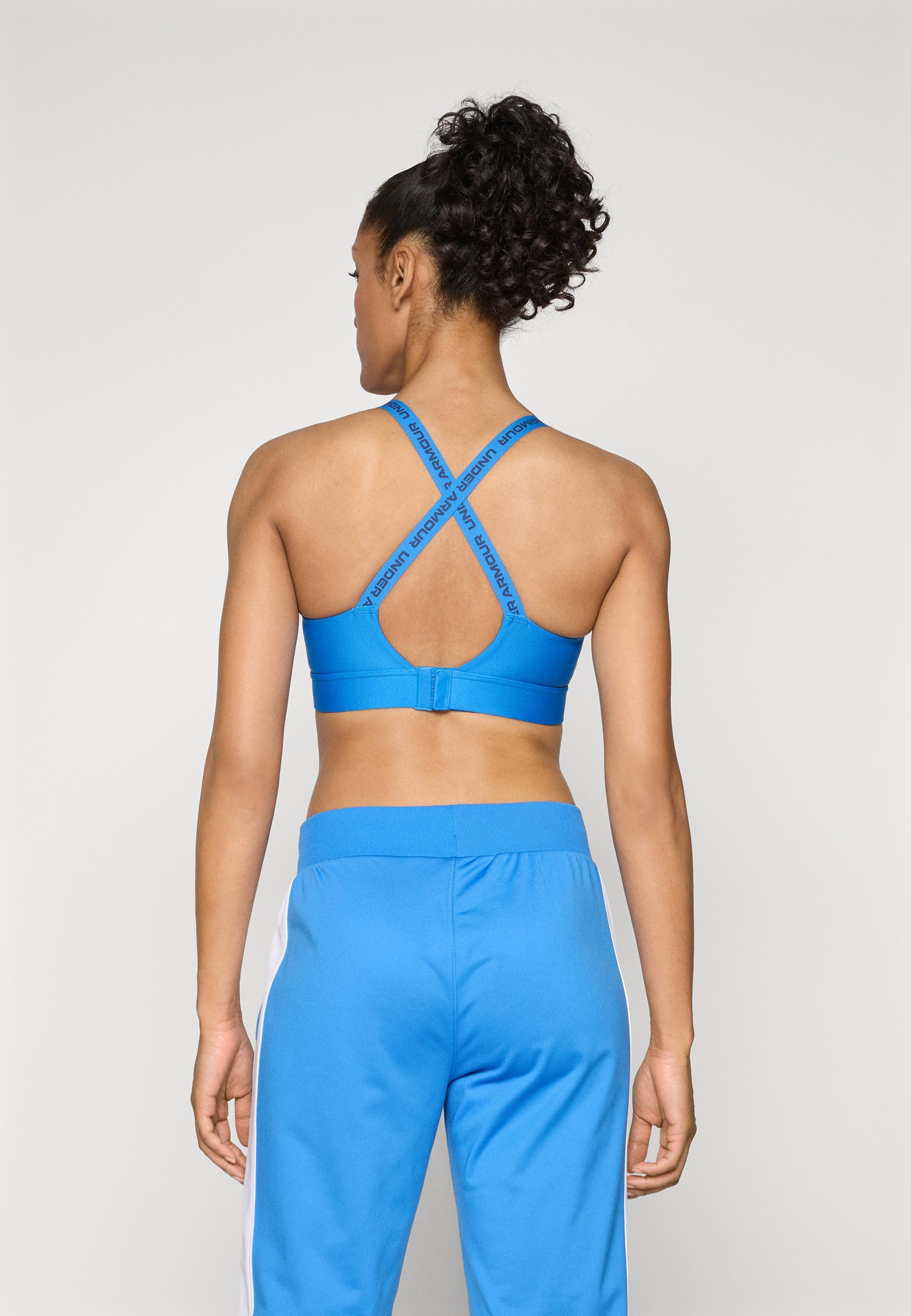 Soutien-gorge de sport Under Armour INFINITY MID BRA - Maintien moyen - Bleu Atlantis/Bleu marine délavé