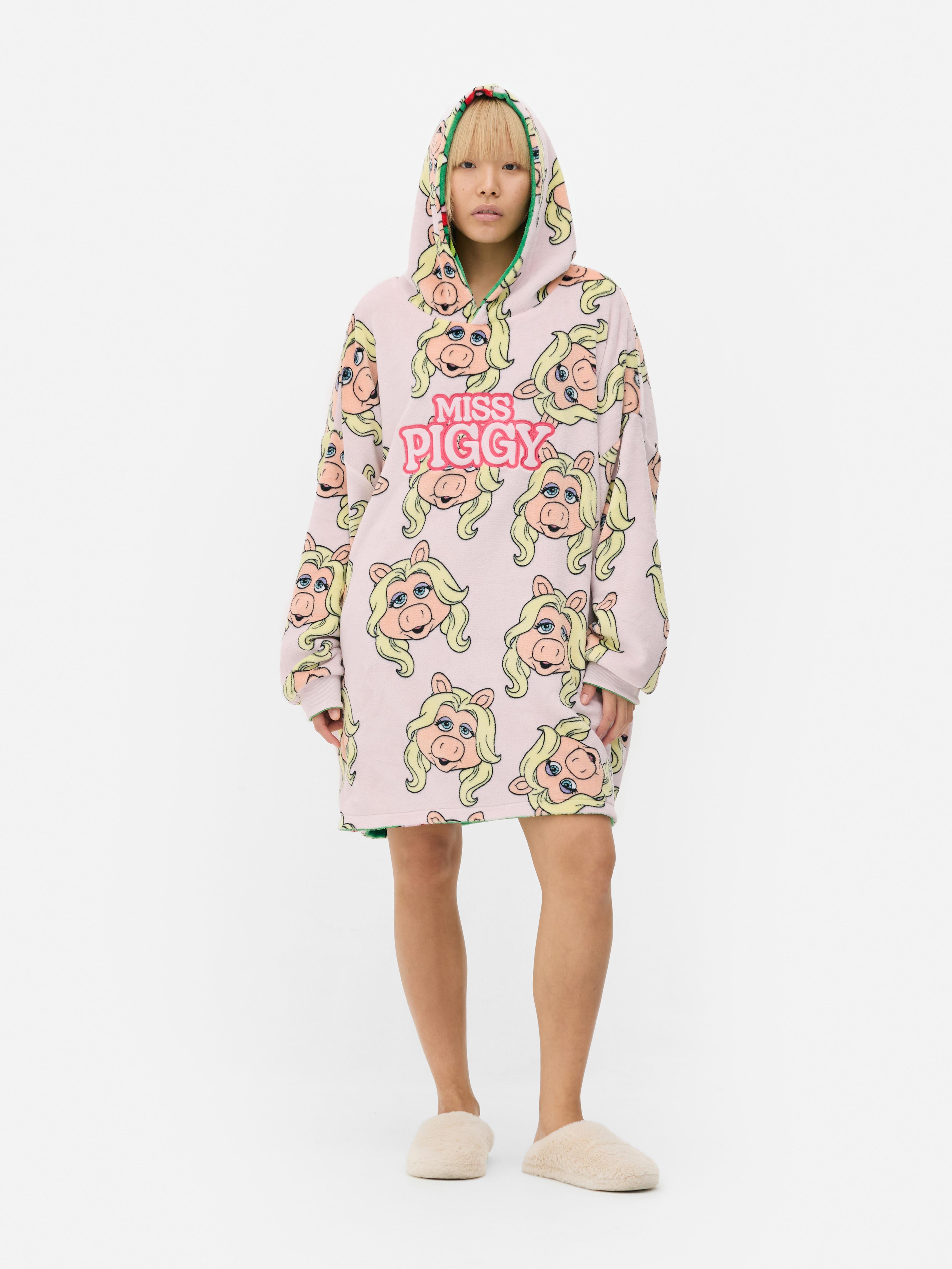 Snuddie reversibil cu Muppets. Un snuddie moale cu un model cu Muppets pe ambele părți.