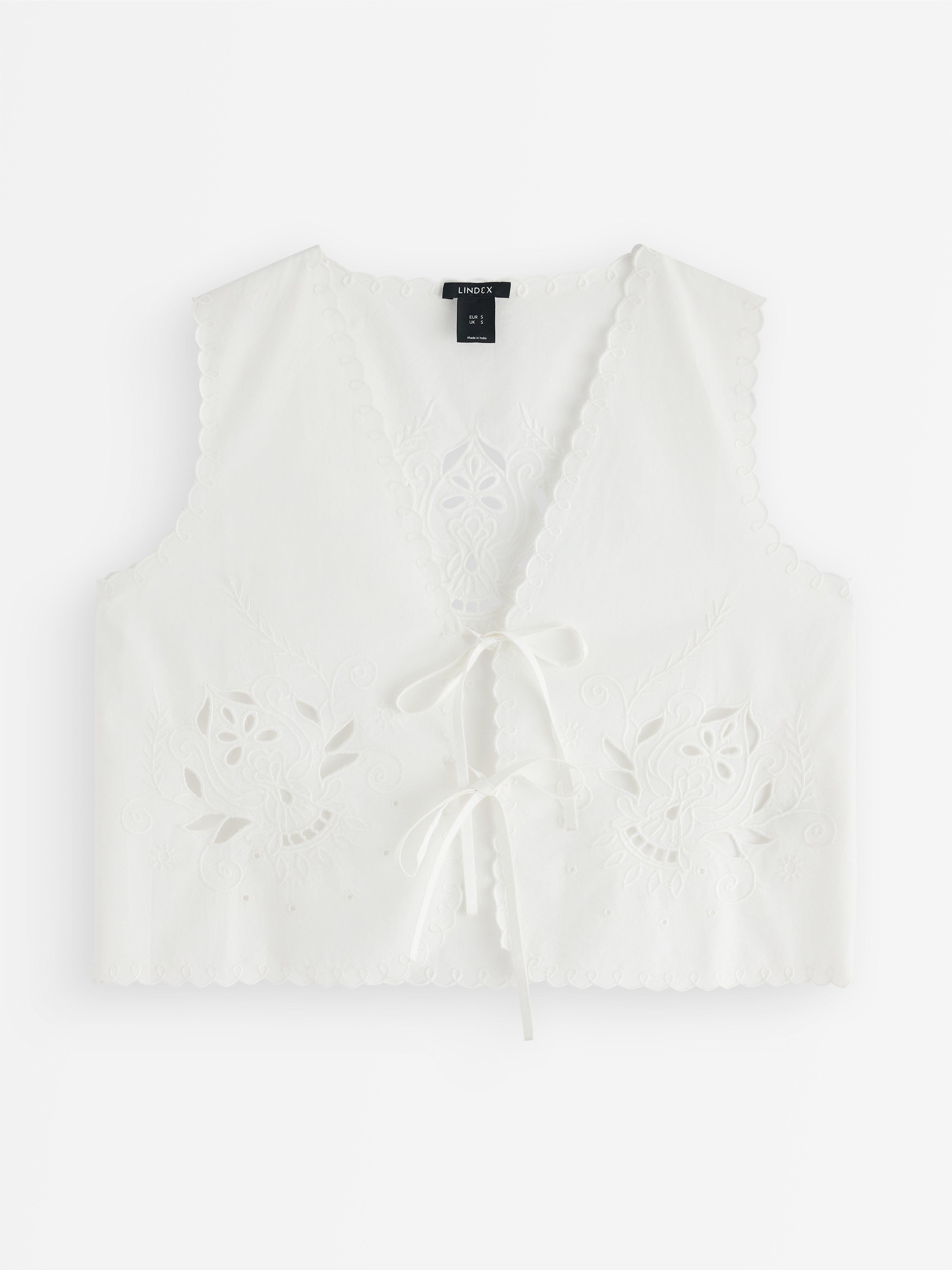 Väst med broderi White