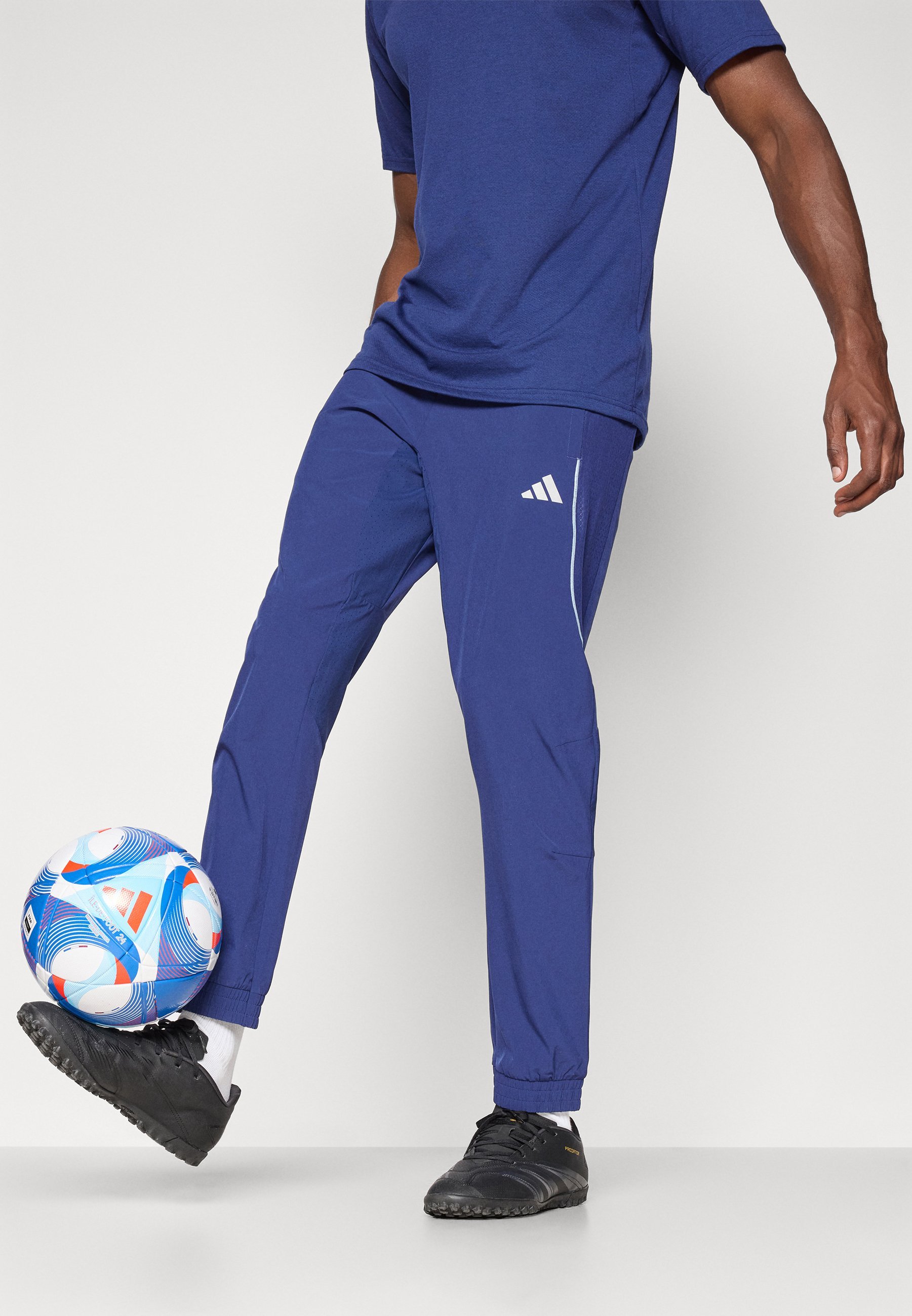 adidas Performance TECH APP - Spodnie dresowe - granatowe/świecące niebieskie