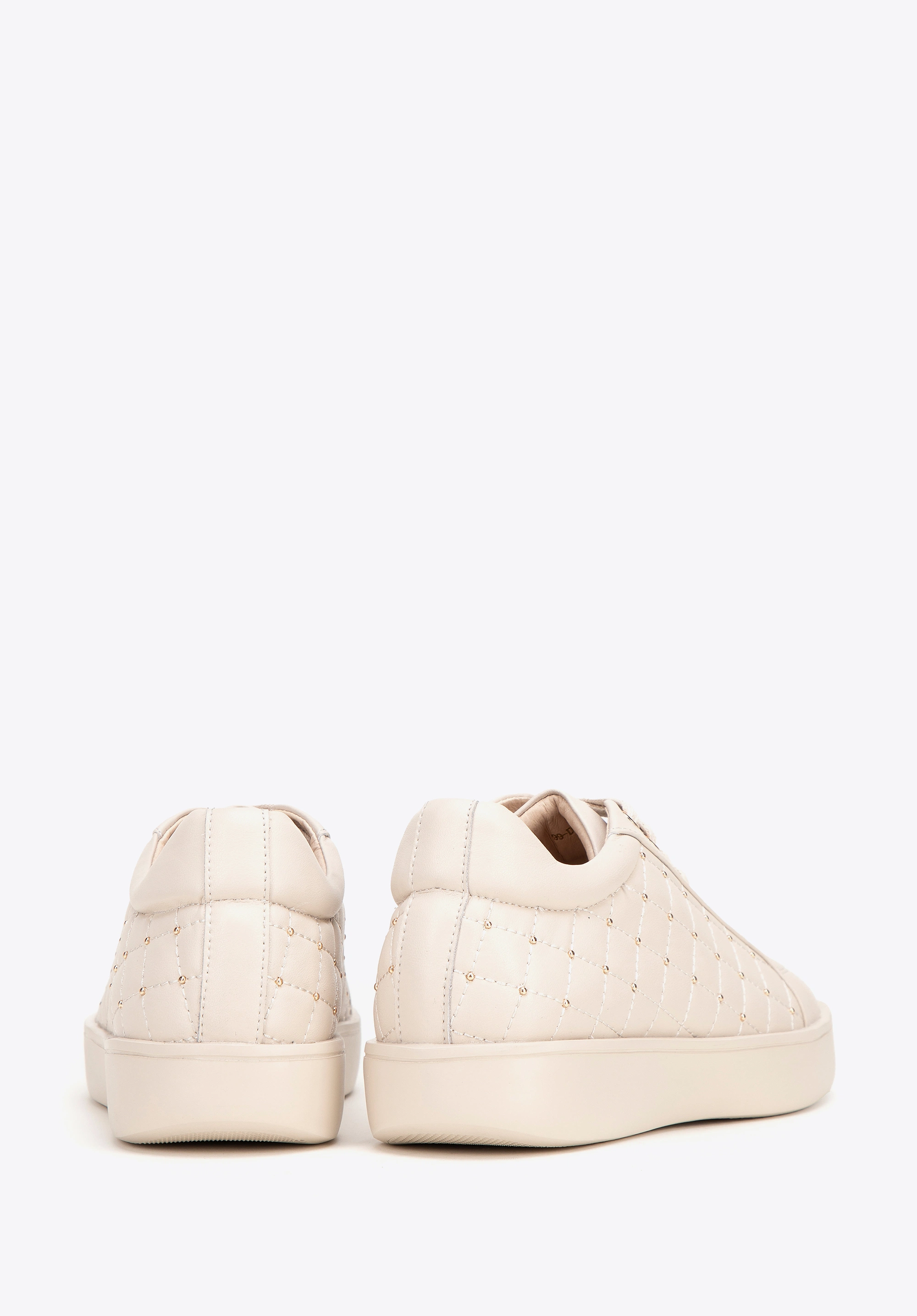 Damskie sneakersy skórzane z pikowaną cholewką kremowe