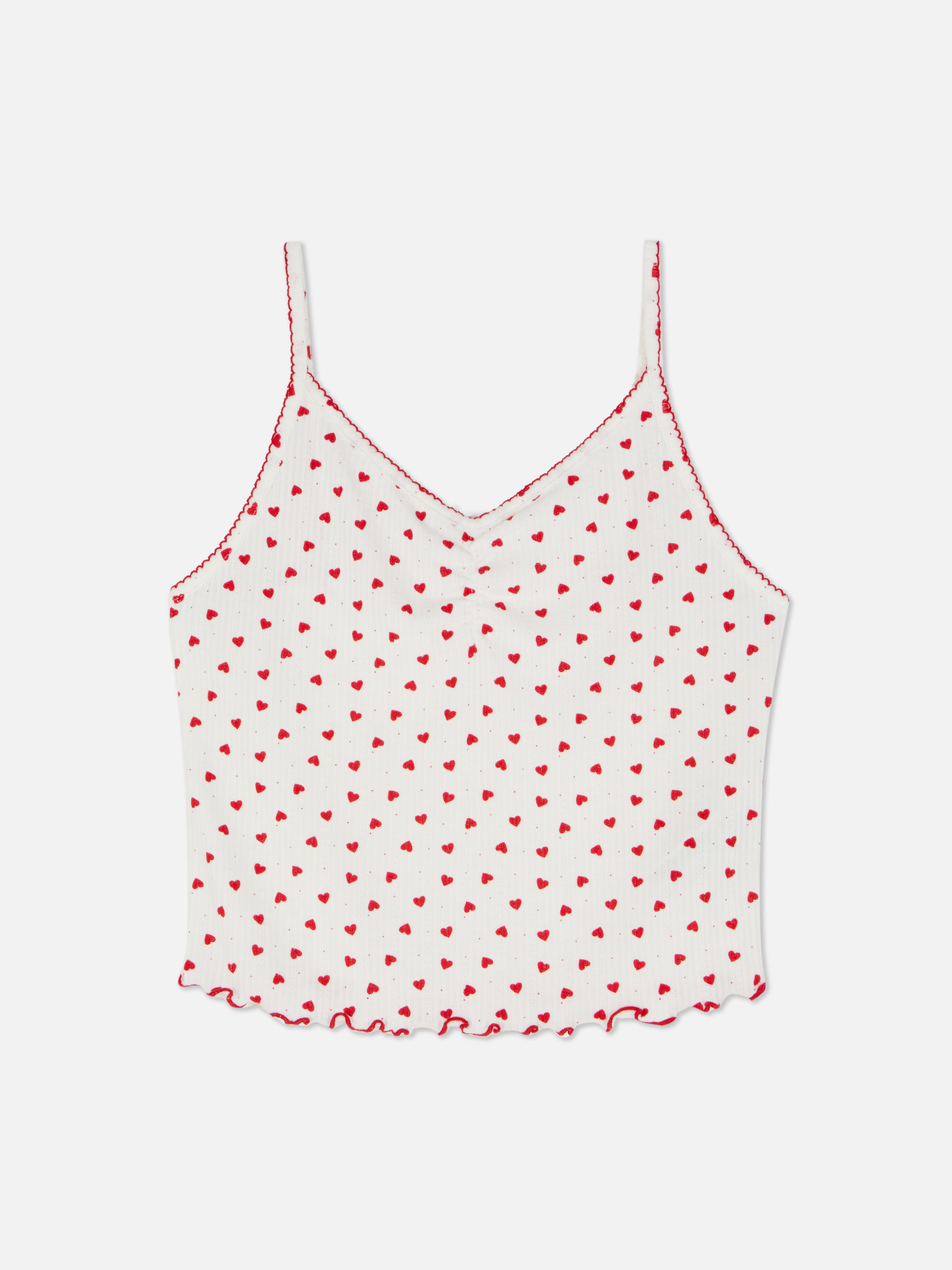 Top de pijama cu model cu inimă Un top de pijama cu decolteu în V, bretele subțiri și tiv festonat