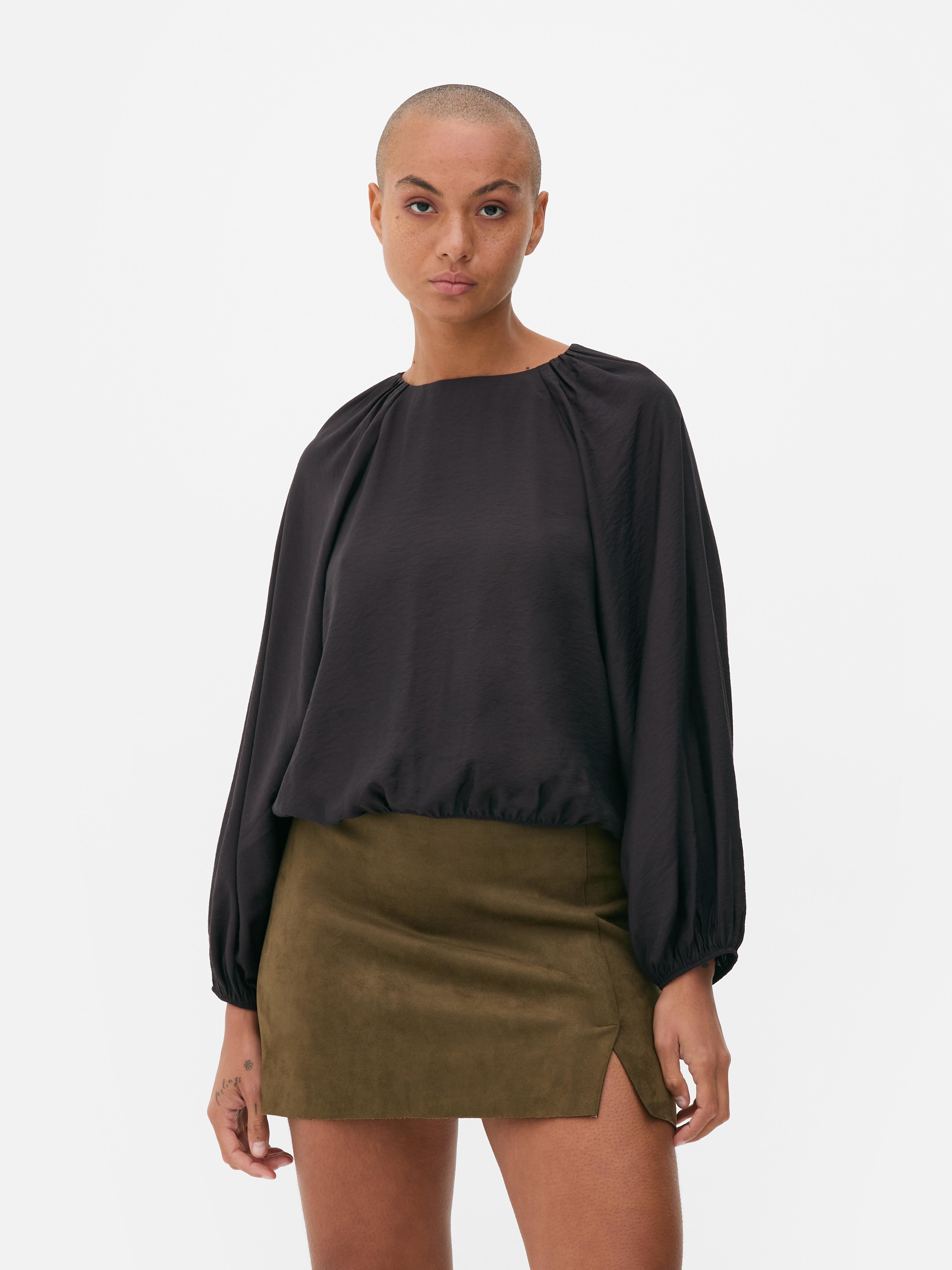 Elastische top met lange mouwen Deze top met elastische kraag, manchetten en zoom past moeiteloos in je garderobe