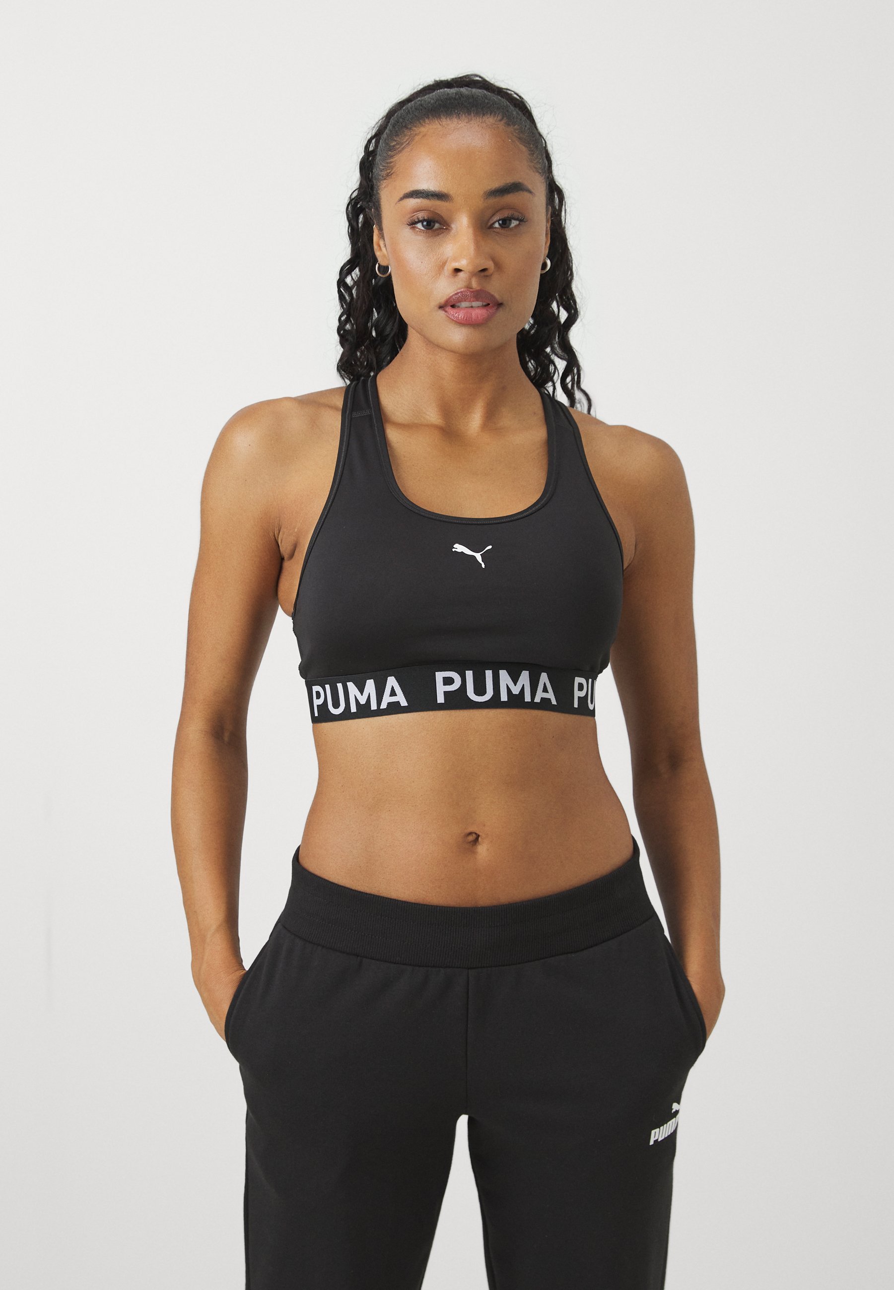 Puma KEEPS ELASTIC - Sportovní podprsenka se střední oporou - černá
