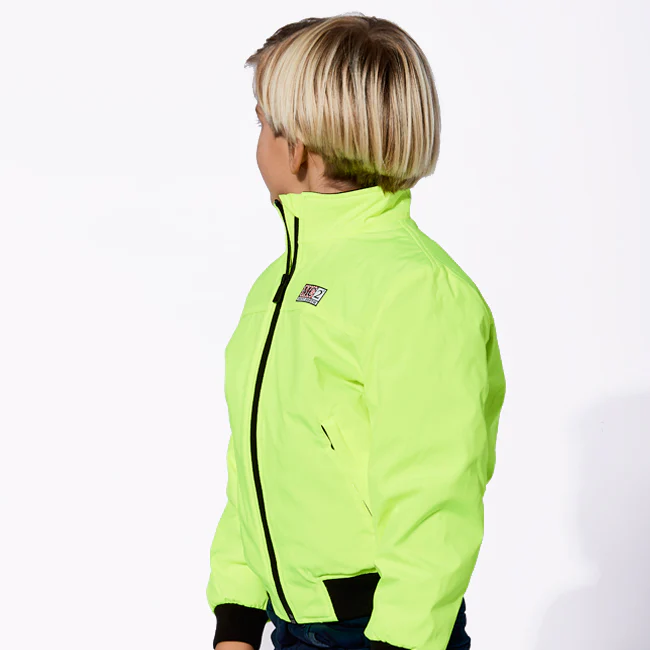 Chaqueta bomber infantil de color amarillo fluorescente con forro de piel.