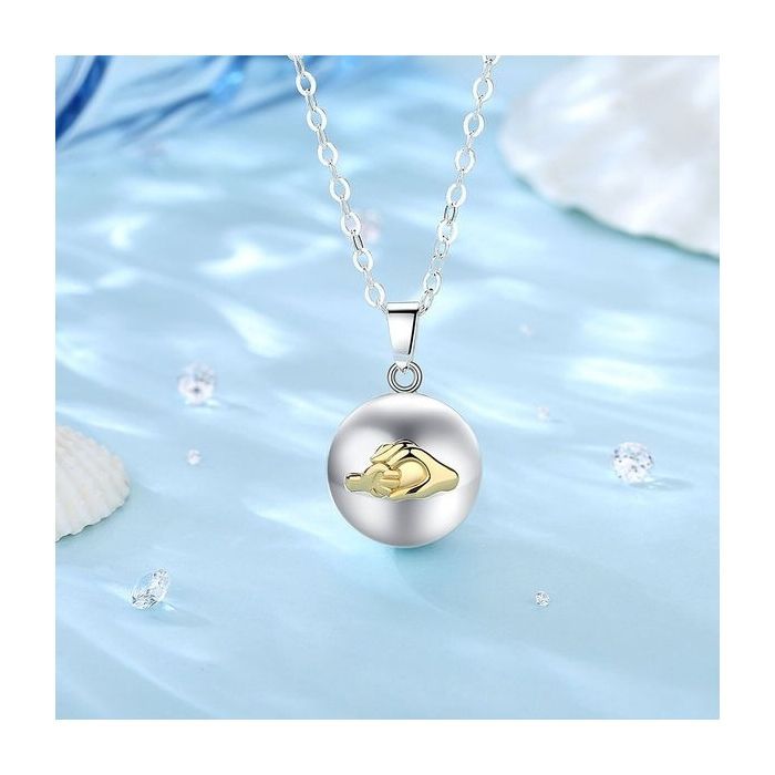 Pregnancy bola with a golden hand motif, mother and child necklace jewelry