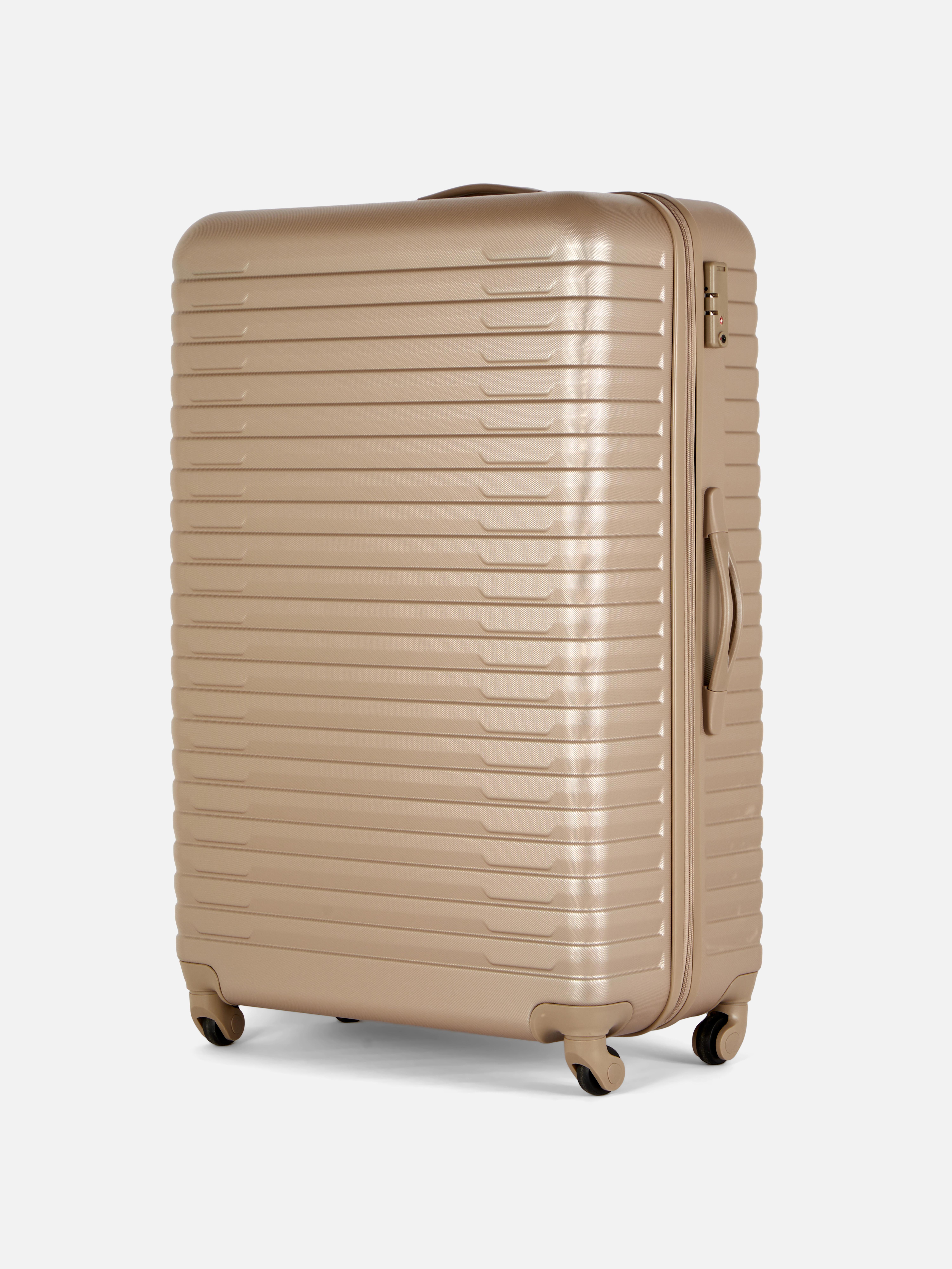 Valiză rigidă cu design striat și patru roți. Valiza noastră rigidă cu patru roți este perfectă pentru următoarea ta vacanță.