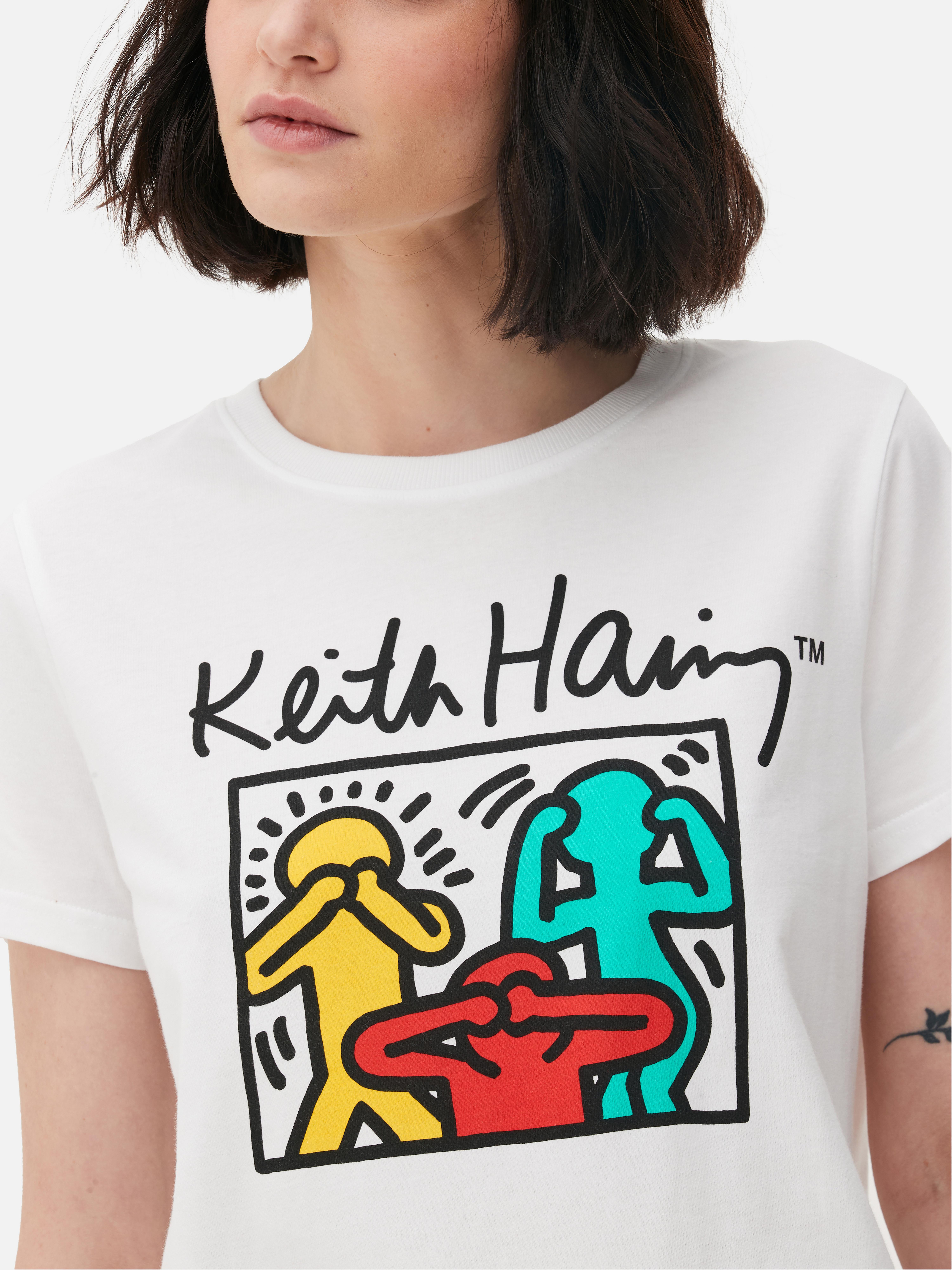 Tricou cu imprimeu Keith Haring Înveselește-ți colecția cu acest tricou cu mânecă scurtă, care prezintă culorile vibrante și figurile funky ale lui Keith Haring.