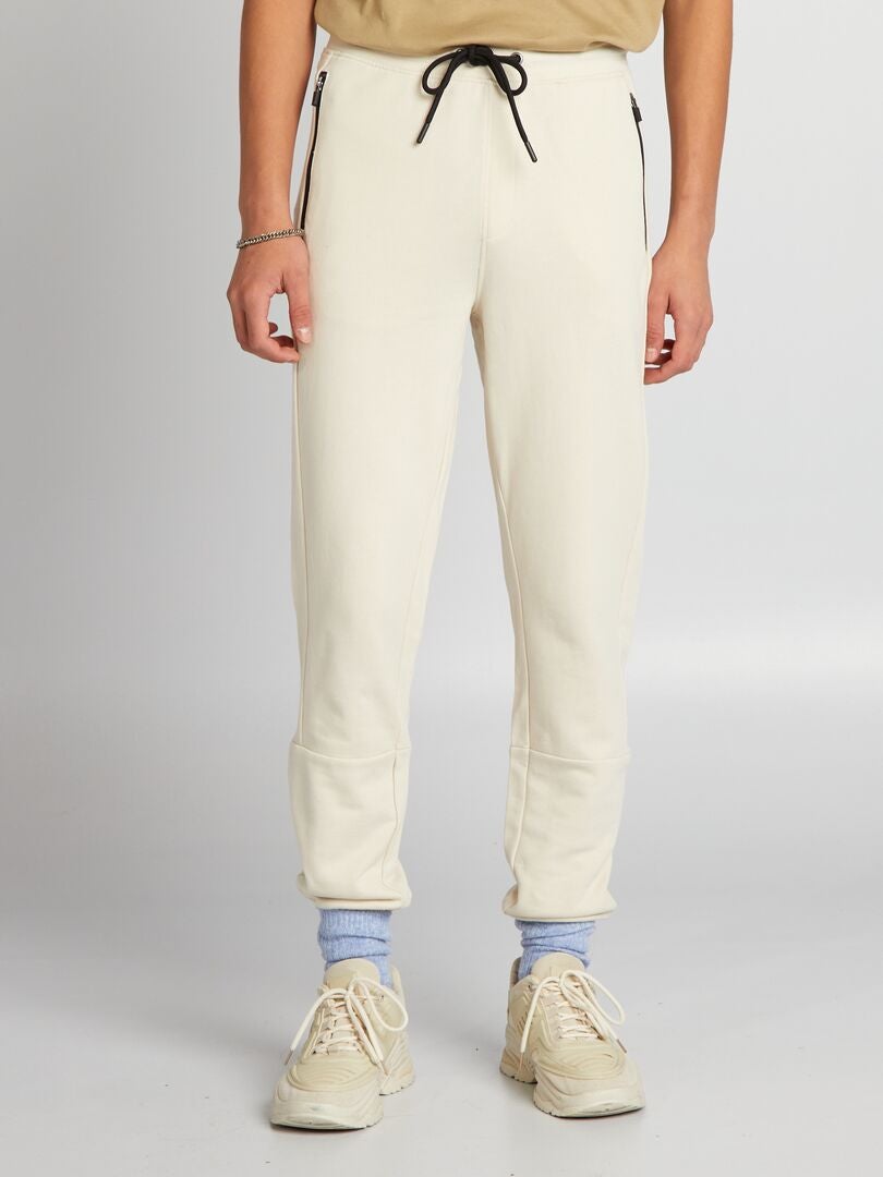 Pantalones deportivos con detalles en contraste - beige