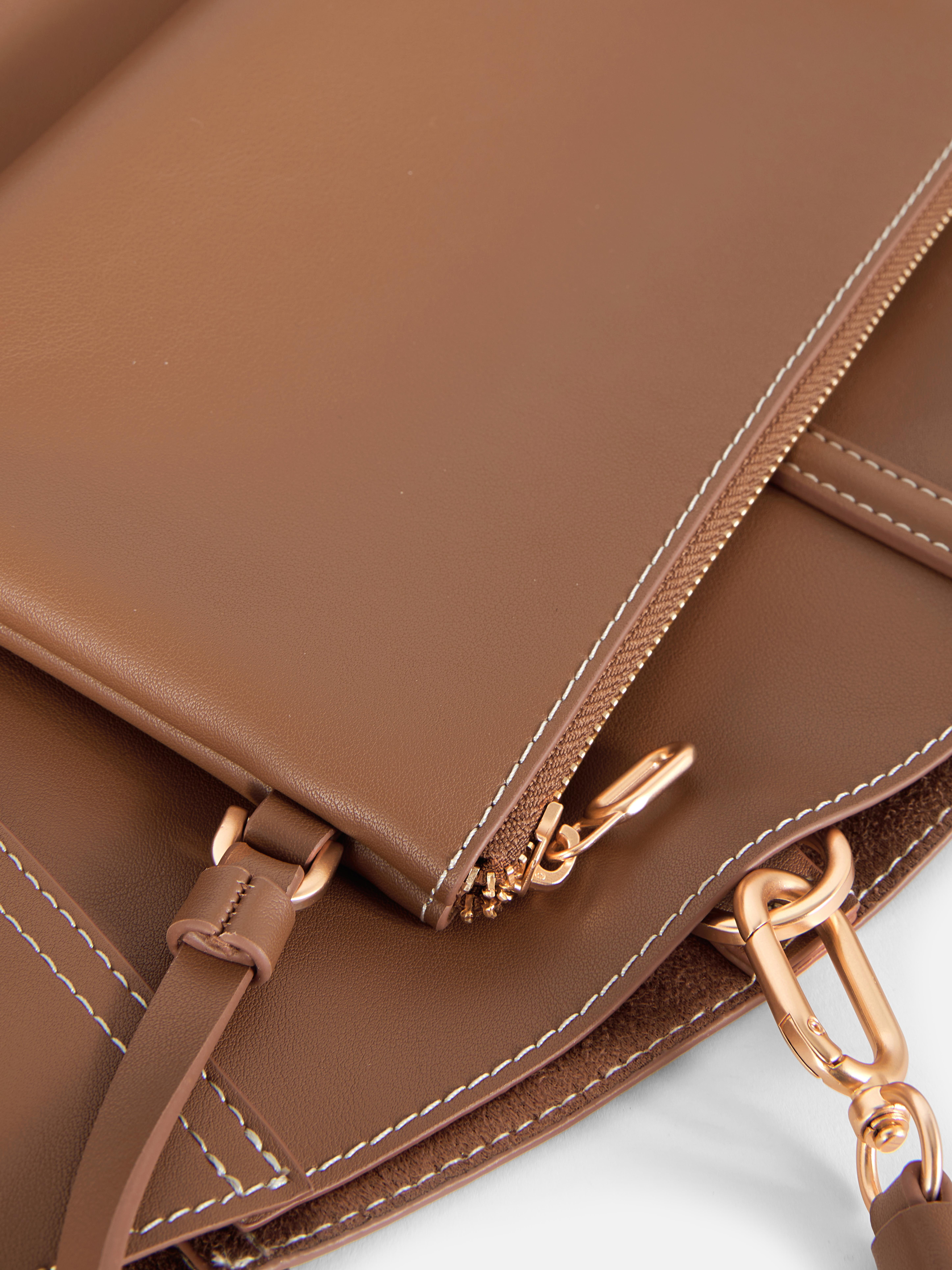 Große Schultertasche aus Kunstleder von The Edit. Eine minimalistische, farblich abgestimmte Tragetasche für den täglichen Weg zur Arbeit.