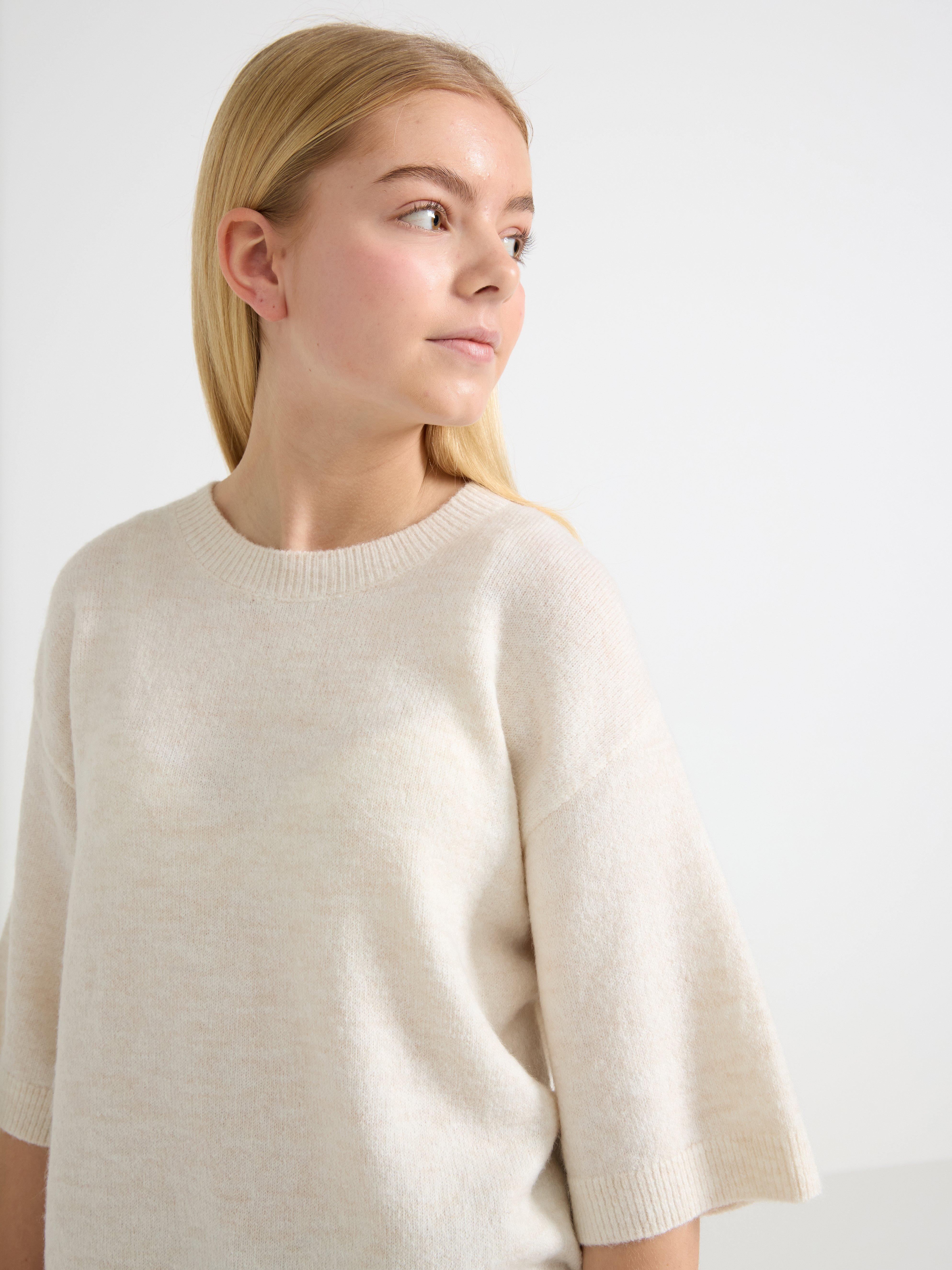 Jersey de punto de manga corta color beige claro jaspeado