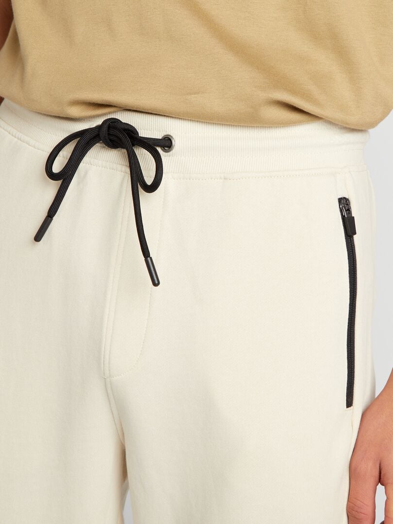 Pantalones deportivos con detalles en contraste - beige