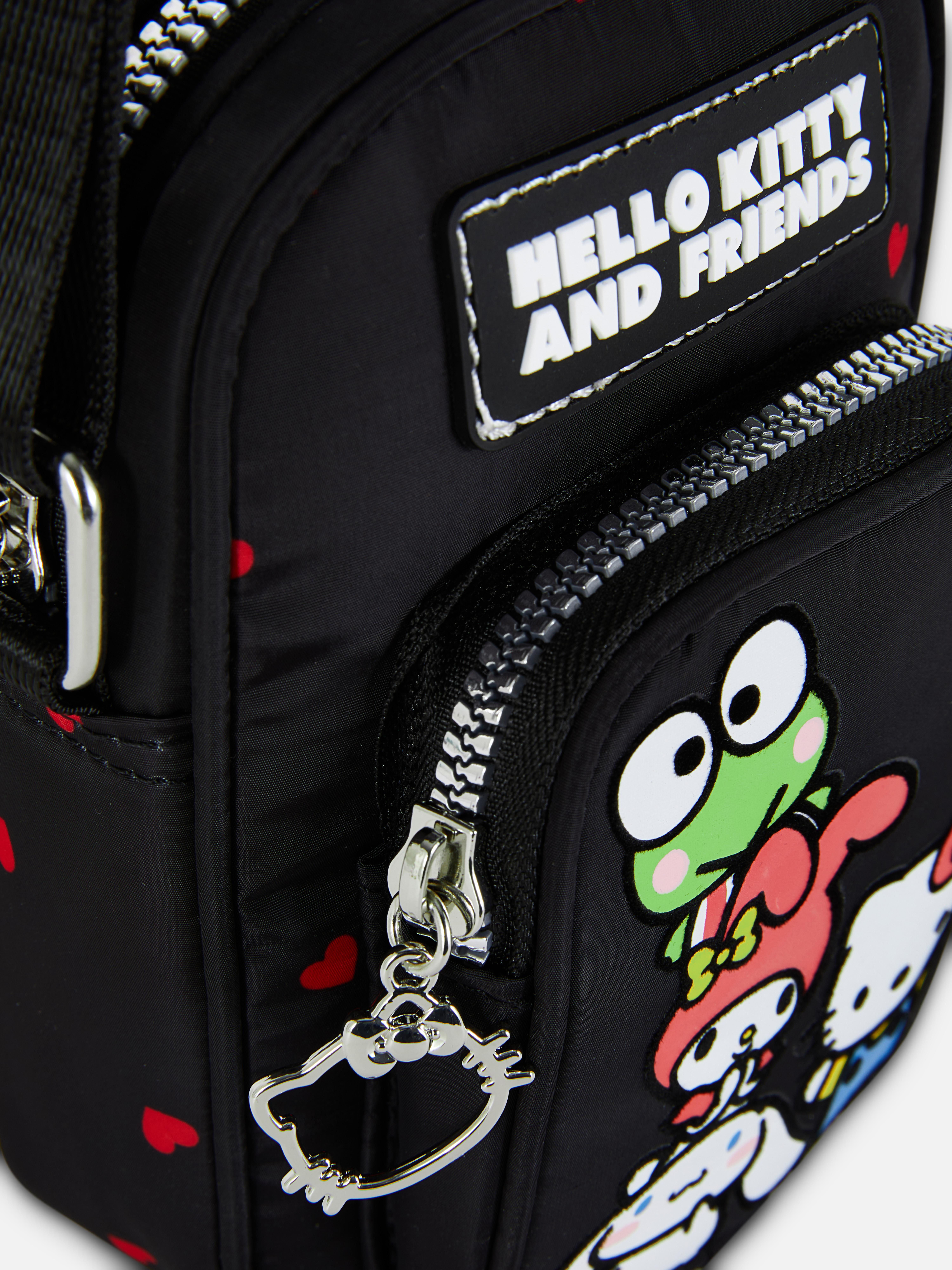 Hello Kitty und Freunde Handytasche Eine Handytasche mit verstellbarem Schultergurt, Reißverschlusstaschen und Sanrio-Figuren