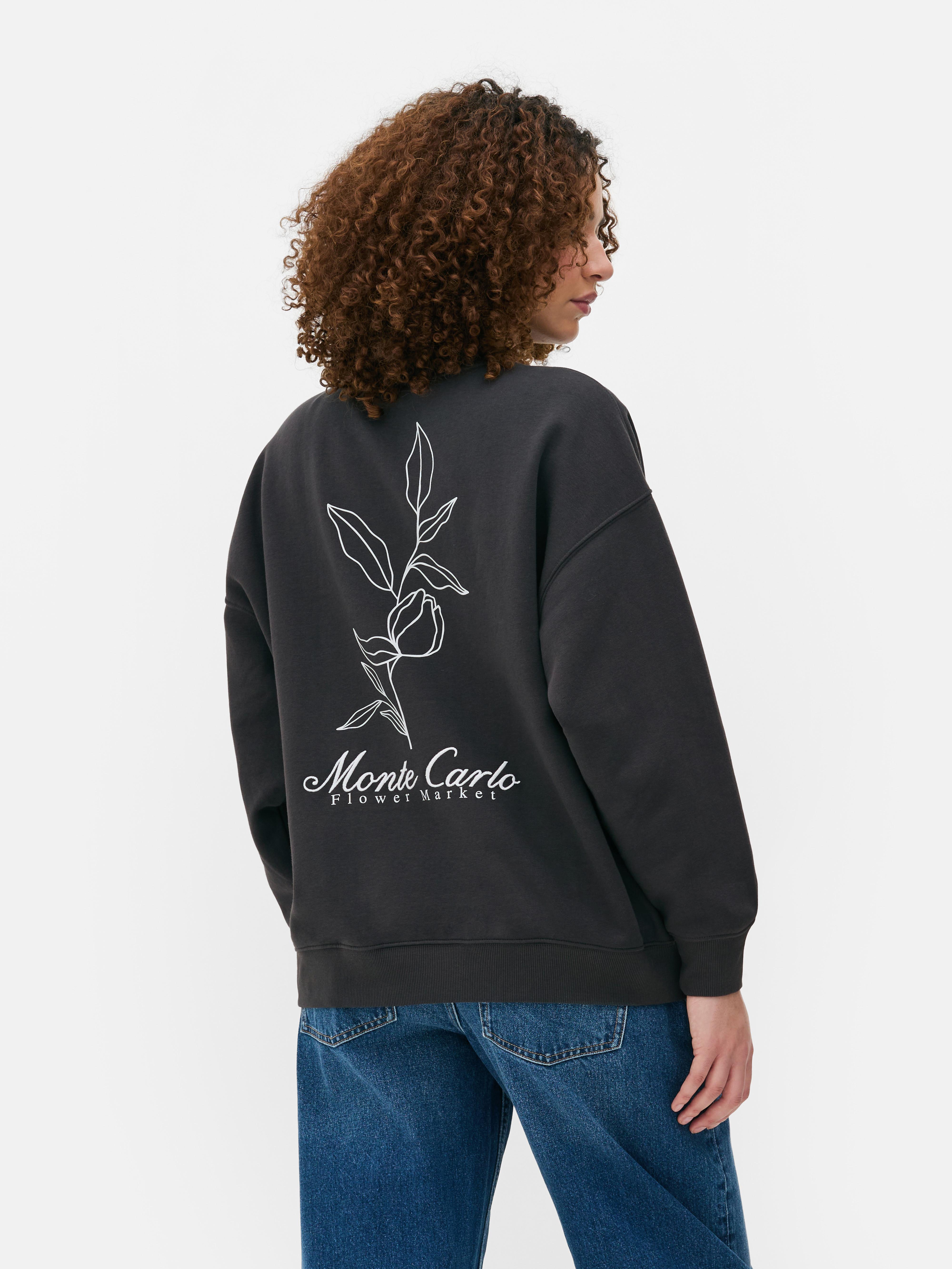 Felpa oversize stampata Questa felpa oversize con una stampa accattivante sul davanti e sul retro è perfetta per uno stile versatile.