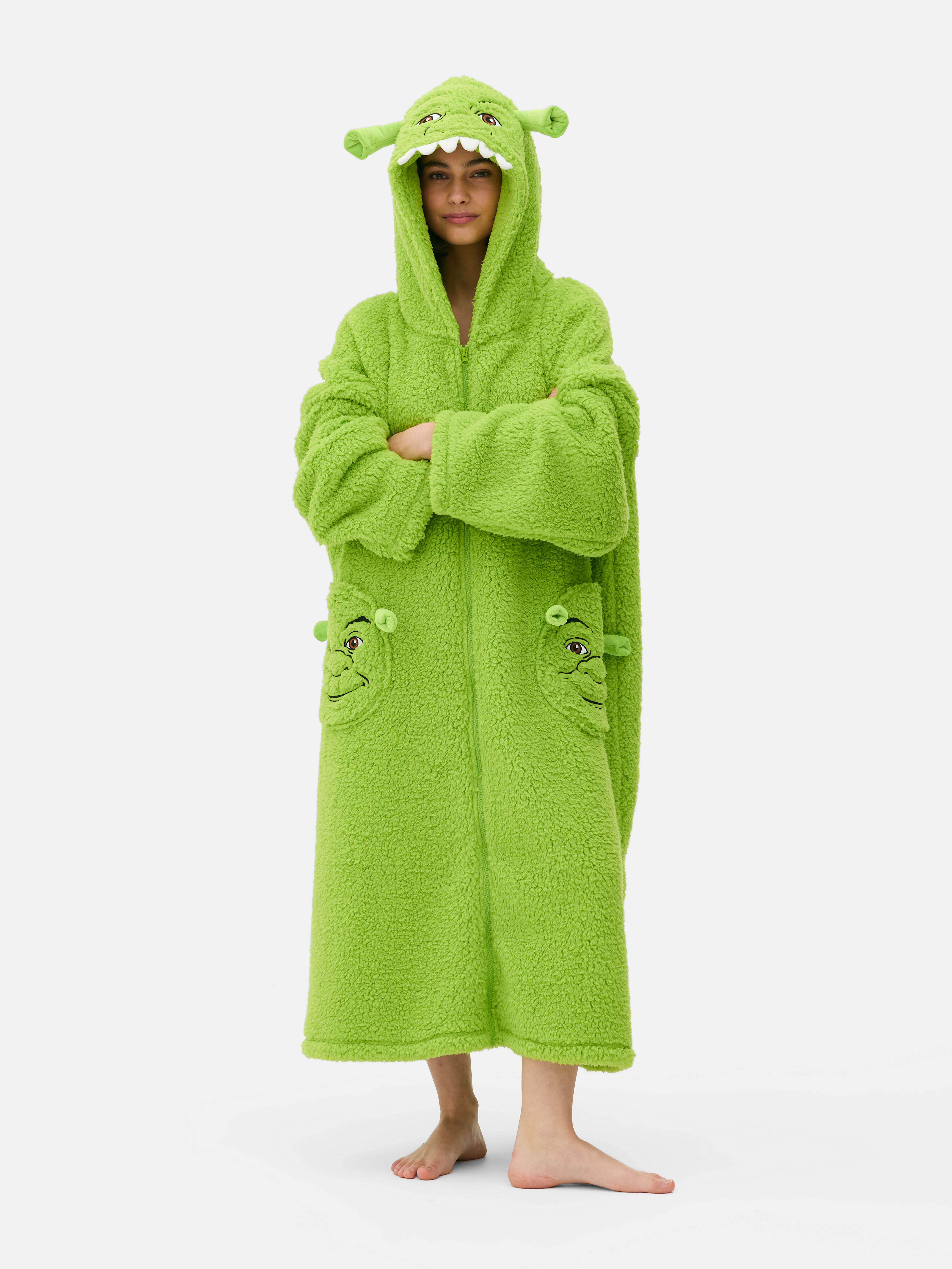Hanorac lung de damă cu design Shrek. O hanorac lung cu glugă spațioasă, fermoar frontal și buzunare aplicate.