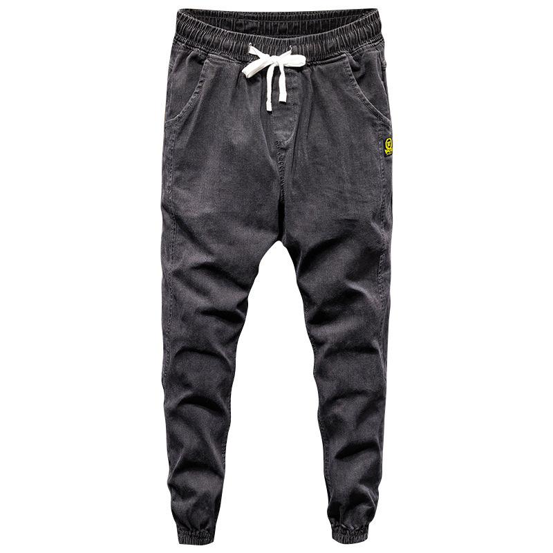 Trendy streetwear herenjeans: blauwe losse denim cargobroek, hiphop jeans met print, designer joggingbroek in Japanse stijl.