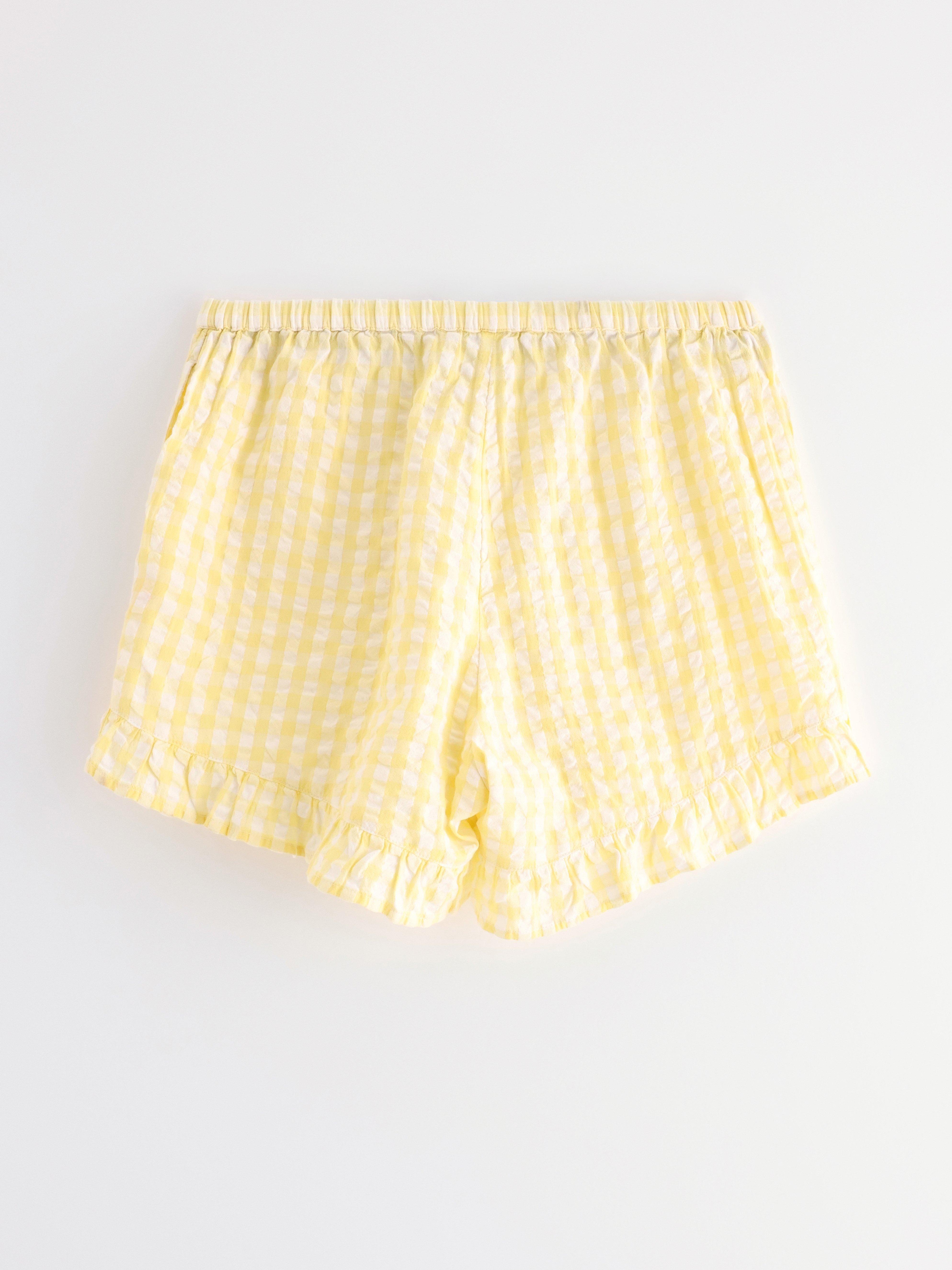 Pyjamasshorts i ryggsekk lys gul