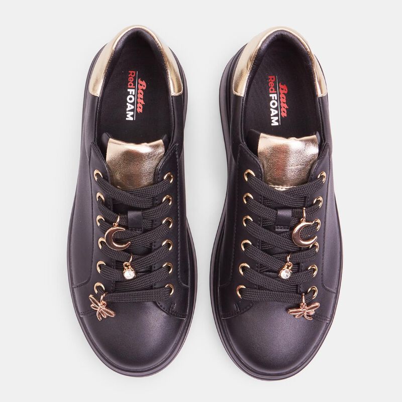 Damsneakers med snörning och juvelapplikationer