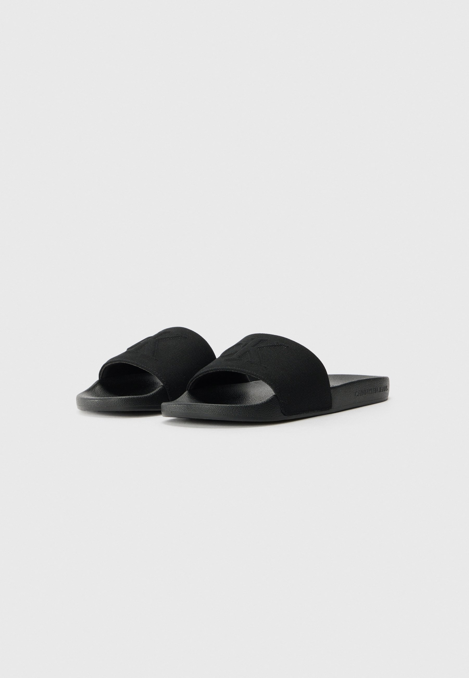 Calvin Klein Jeans SLIDE MONO - Nazouvací boty - black